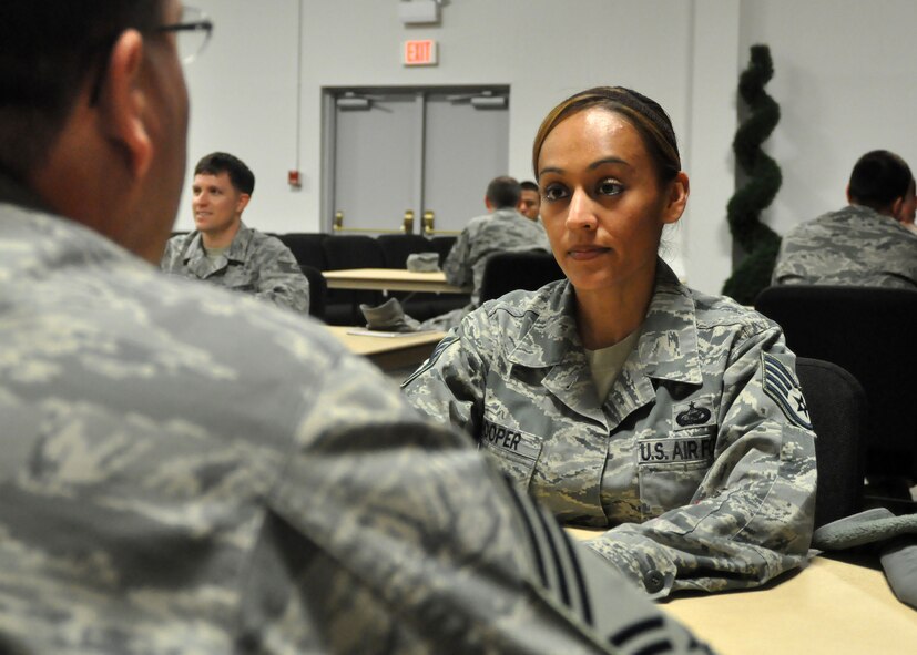 Staff Sgt. Annette Hooper, 627th Force Support Squadron, listens to words of advice during a speed mentoring session March 23, 2012, at the McChord Field Chapel Support Center, Joint Base Lewis-McChord, Wash. The monthly speed mentoring sessions provide Airmen of any rank an opportunity to receive direct mentoring from senior noncommissioned officers. (U.S. Air Force photo/Senior Airman Leah Young)
