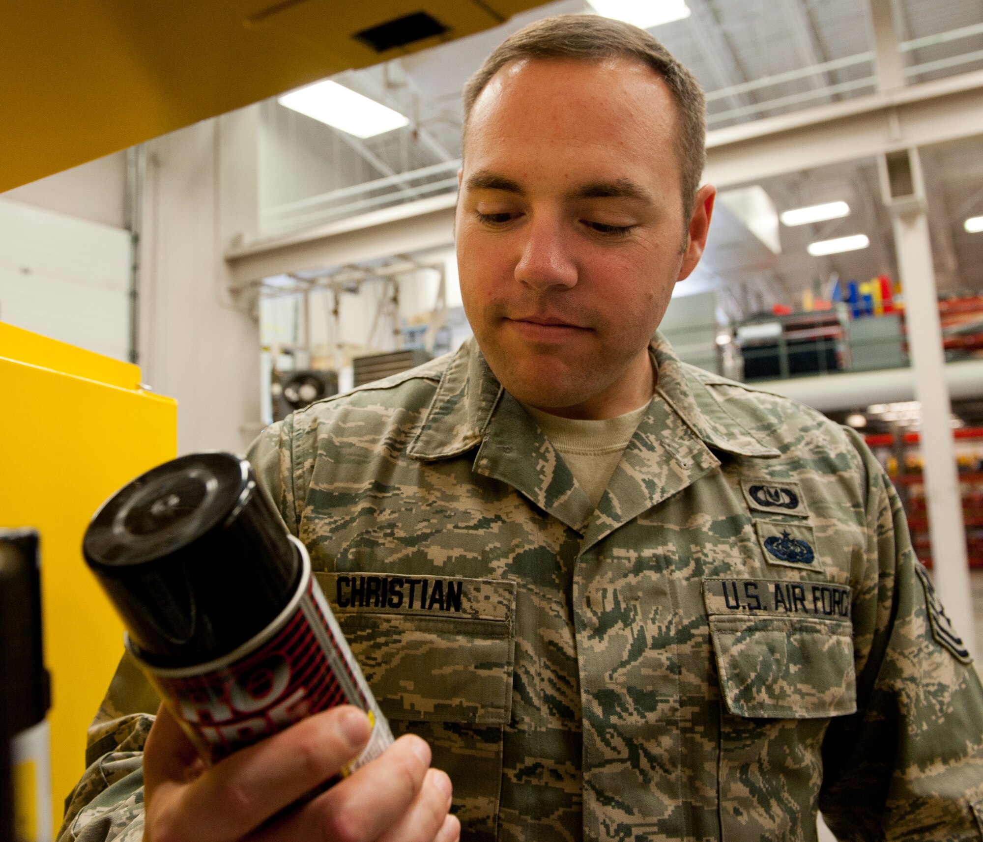 Tech. Sgt. Shane Christian, 28th Bomb Wing Ground Safety NCO in charge, inspects items contained in a flammable cabinet during a routine inspection at the 37th Bomb Squadron support section on Ellsworth Air Force Base, S.D., March 30, 2012. Ground safety specialists prevent risk in the workplace by ensuring that Ellsworth Airmen comply with safety standards and regulations, and are educated on safety issues. (U.S. Air Force photo by Airman 1st Class Kate Thornton/Released)