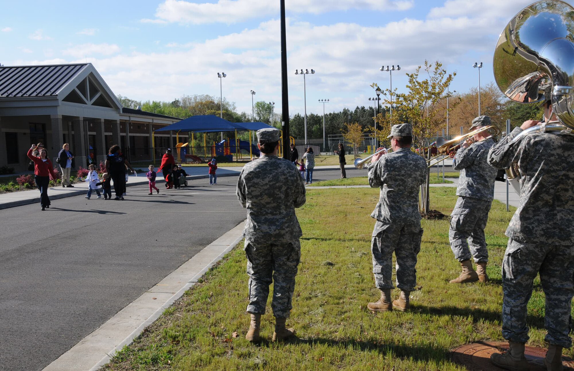 The Army Training and Doctrine Command Band play fun melodies for the children in the parking lot at Fort Eustis Pershing Child Development Center April 2, 2012. The TRADOC Band came out to show their support for National Child Abuse Prevention Month. (U.S. Air Force photo by Tetaun Moffett/ Released)