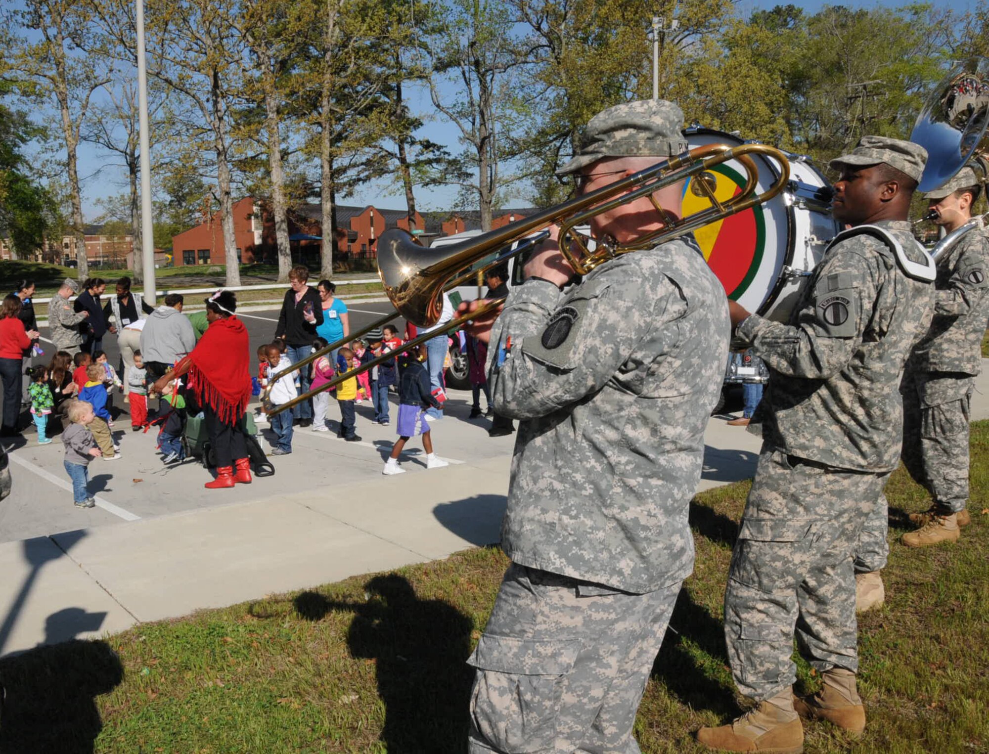 The Army Training and Doctrine Command Band play fun melodies for the children in the parking lot at Fort Eustis Pershing Child Development Center April 2, 2012. The TRADOC Band came out to show their support for National Child Abuse Prevention Month. (U.S. Air Force photo by Tetaun Moffett/ Released)
