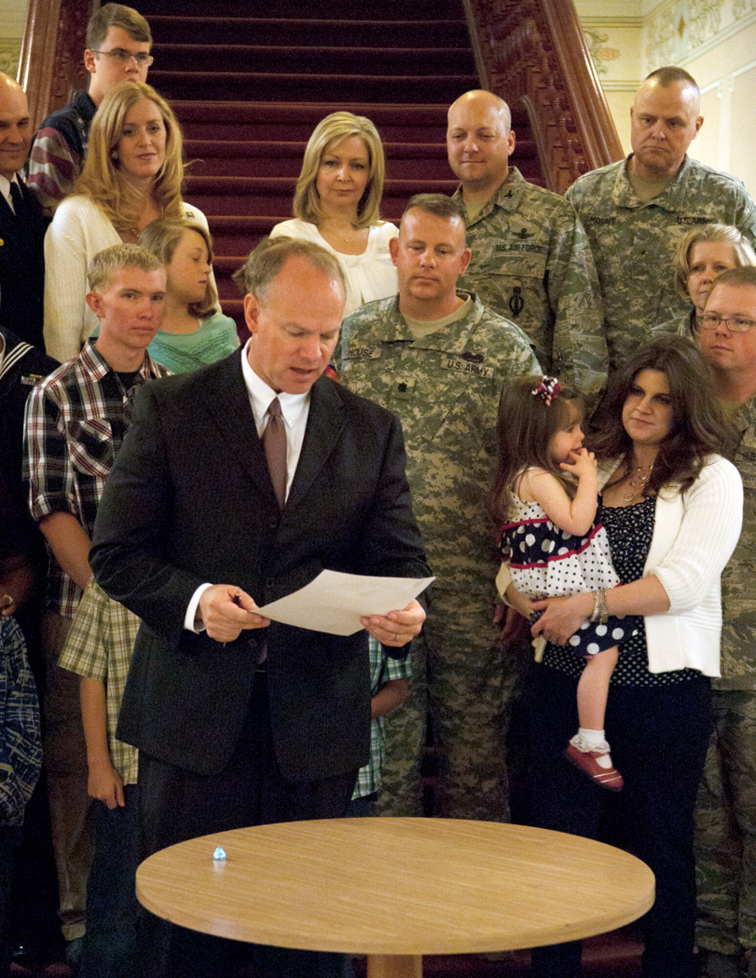 Wyoming Gov.  Matt Mead signs a proclamation in the Wyoming Capitol Building March 29 officially establishing April as the Month of the Military Child. The proclamation says that dedicating April to military children will pay tribute to the approximately 5,000 Wyoming children and youths directly affected by military deployments and encourage the local community to support them. (U.S. Air Force photo by Airman Jason Wiese)