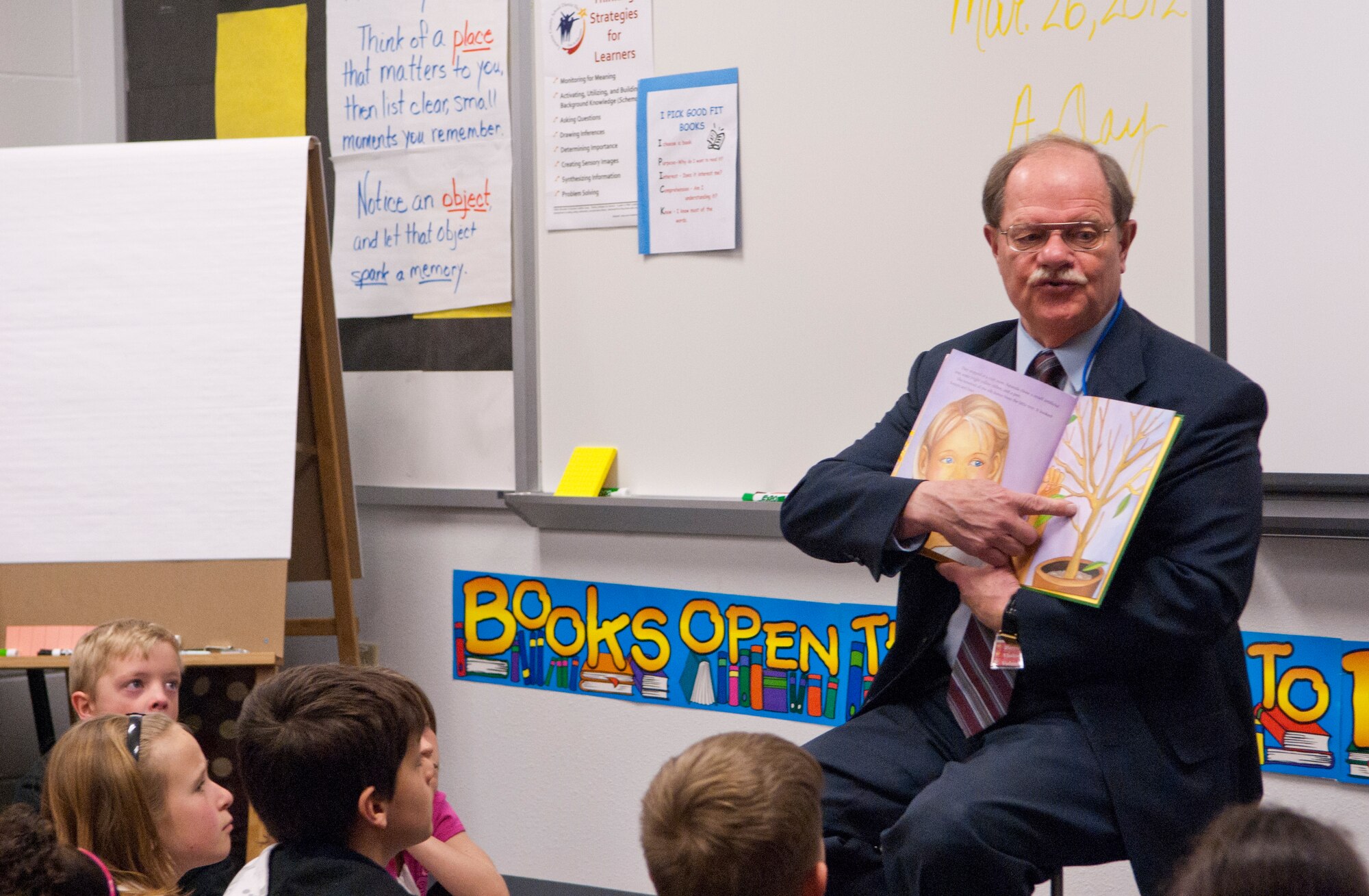 Cheyenne, Wyo., Mayor Richard Kaysen reads the “The Wishing Tree” to third-grade students of Freedom Elementary School March 26. Kaysen is a Vietnam War veteran who is aware of the hardships associated with military life. (U.S. Air Force Photo by Airman Jason Wiese) 