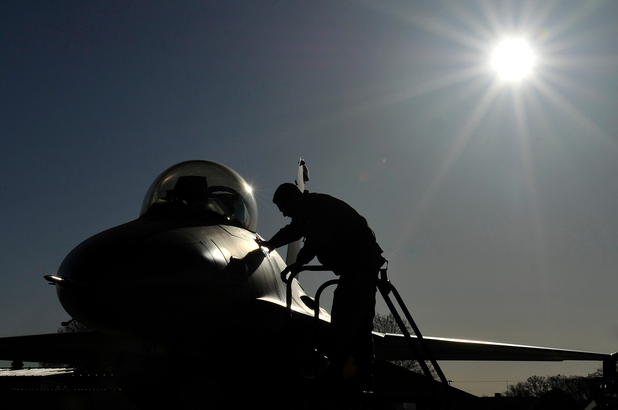 An Airman from the 113th Aircraft Maintenance Squadron prepares an F-16 Fighting Falcon for a training mission April 3, 2012 at Joint Base Andrews, Md. The 113th Wing provides air sovereignty forces to defend the National Capital Region and also provides fighter, airlift and support forces capable of local, national and global employment. (U.S. Air Force Photo/Senior Airman Perry Aston)