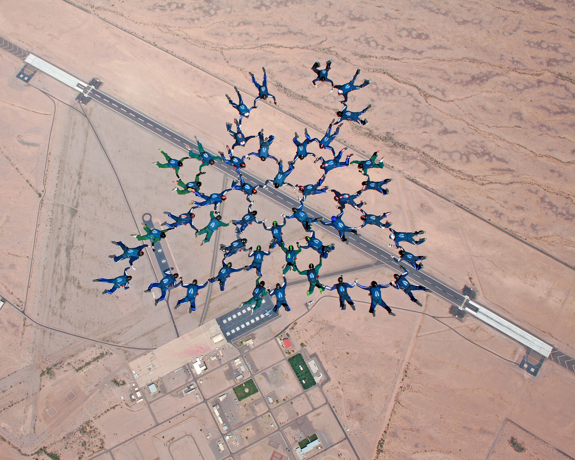 Air Force Academy Cadets form up while attempting to break the largest formation collegiate record with a 46-person formation Saturday, March 31, 2012. The cadets broke their own record of a 41-person formation they set March 2008. (U.S. Air Force Photo/Tech. Sgt. Joseph Valente)