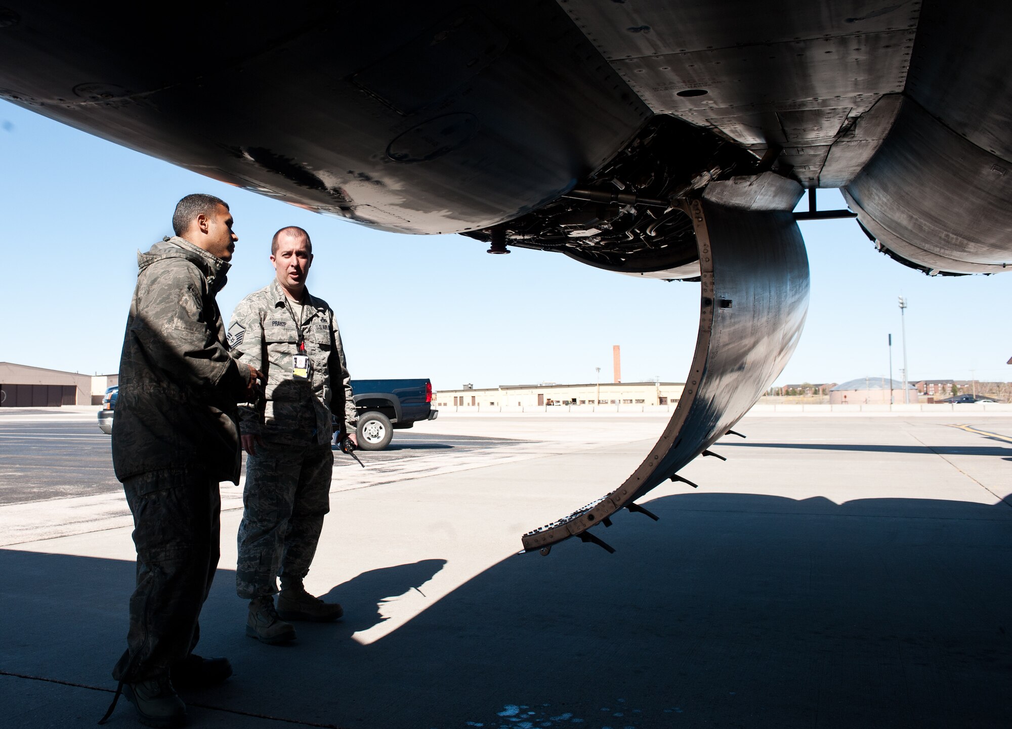 Master Sgt.  Andrew Prakop, 28th Aircraft Maintenance Squadron production superintendent, discusses maintenance work on a B-1 with Staff Sgt. Willy Dominguez, 28th AMXS crew chief, to verify procedures completed at Ellsworth Air Force Base, S.D., March 29, 2012. The production section oversees all scheduled and unscheduled maintenance to ensure aircraft are available to meet mission requirements. (U.S. Air Force photo by Airman 1st Class Alystria Maurer/Released)