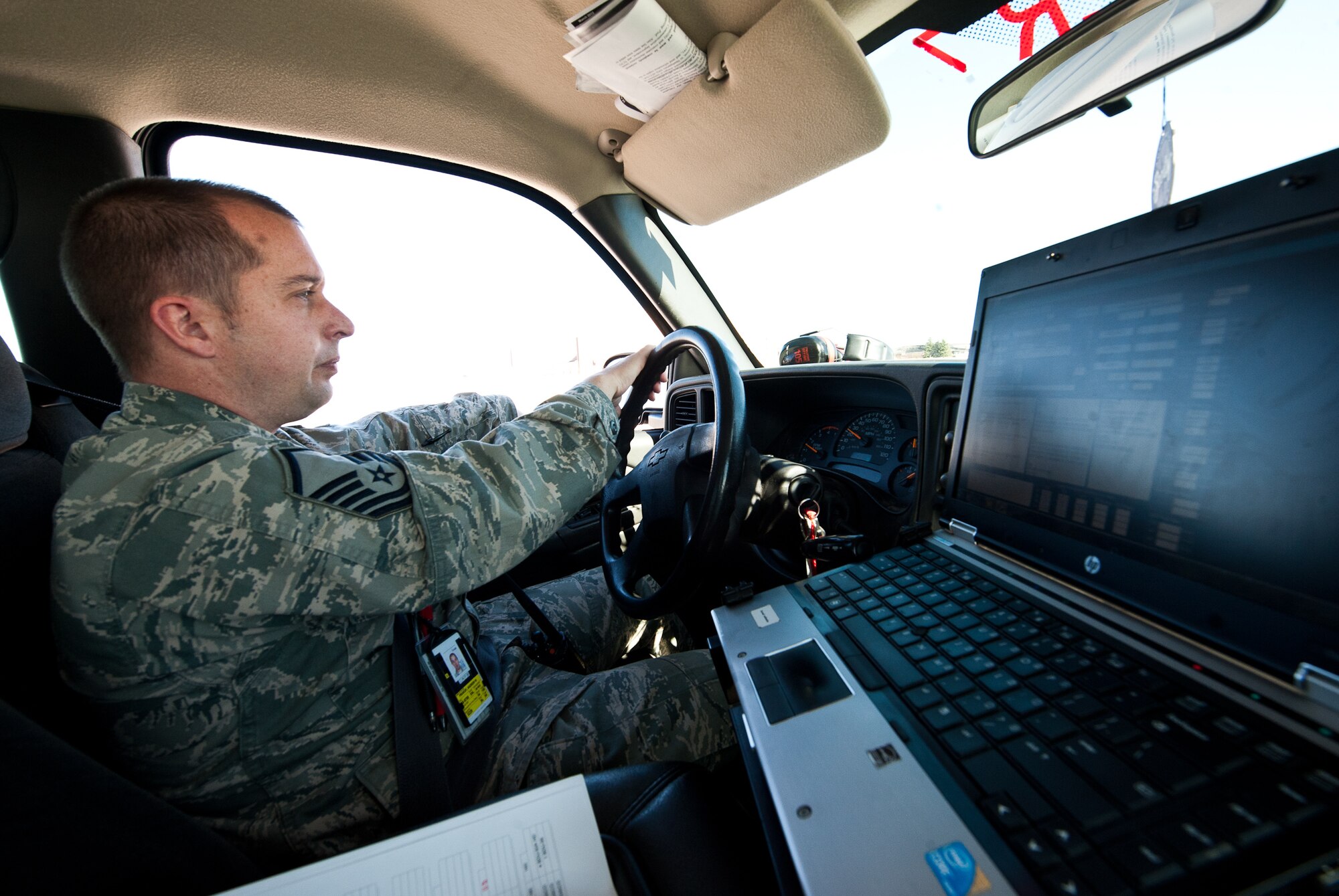 Master Sgt.  Andrew Prakop, 28th Aircraft Maintenance Squadron production superintendent, responds to a call while overseeing maintenance on the fleet of B-1 bombers at Ellsworth Air Force Base, S.D., March 29, 2012. The production section facilitates maintenance operations to ensure aircraft are mission ready. (U.S. Air Force photo by Airman 1st Class Alystria Maurer/Released)