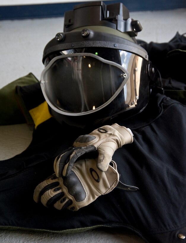The bomb helmet, bomb suit and knuckle buster gloves are important personal protective equipment, ensuring that 11th Civil Engineer Squadron Explosive Ordnance Disposal technicians are safe and equipped to handle any dangerous environment. (Photo/Bobby Jones)