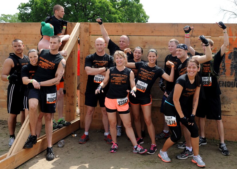The “Muddy Medics” of Dyess Air Force Base stand together in front of the starting line at the Dallas Tough Mudder event March 31, 2012 in Wortham, Texas. Tough Mudder events are 10-12 mile runs with obstacles designed by British Special Forces to test all around strength, stamina, mental grit and camaraderie. To date, Tough Mudder has raised more than $2,886,000 for the Wounded Warrior Project to aid and assist wounded service members. For more information on locations and events visit http://www.toughmudder.com (U.S. Air Force photo by Airman 1st Class Peter Thompson/Released)