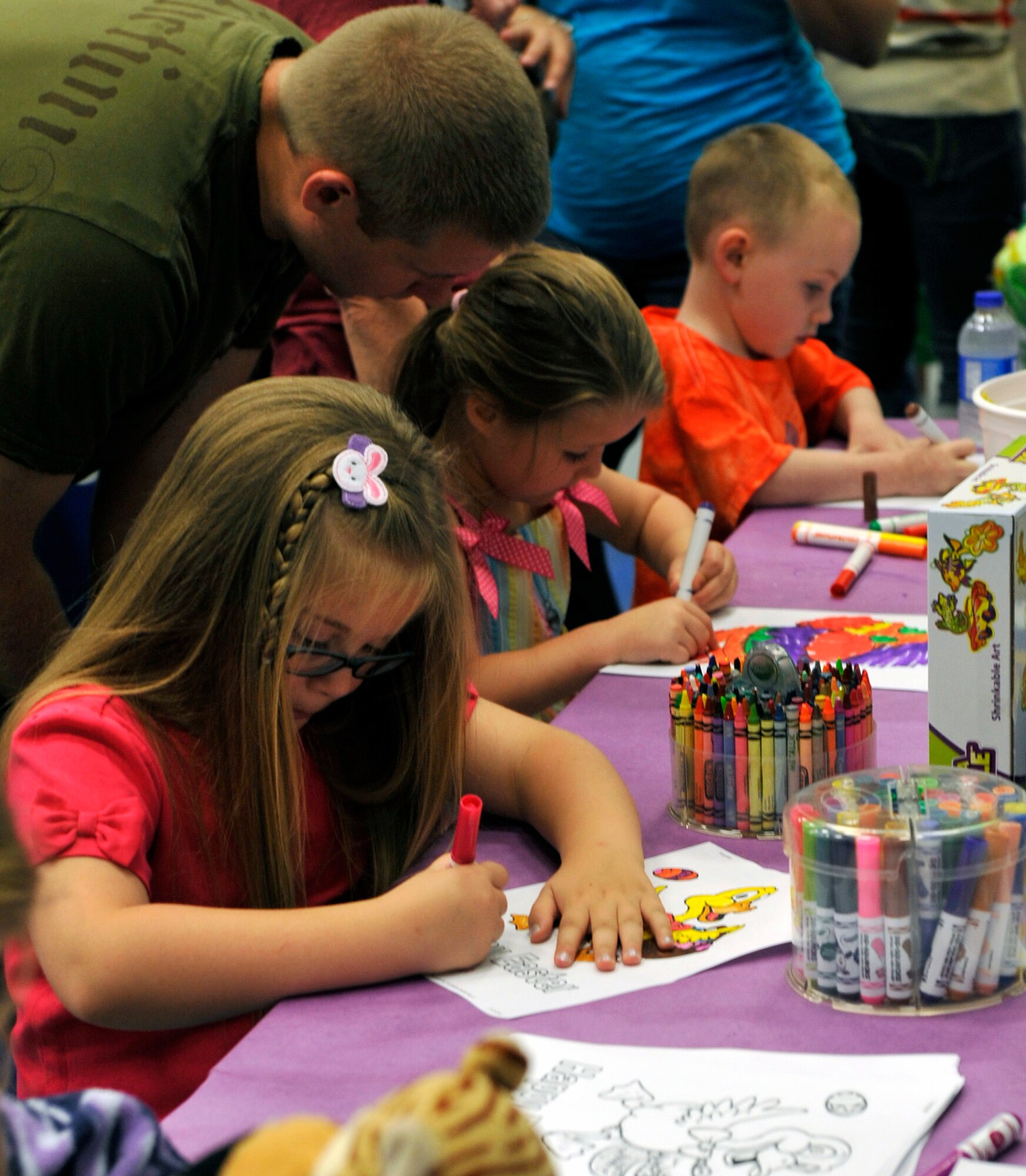 Children participate in a coloring contest inside the youth center during Family Fest, March 31, 2012, at Little Rock Air Force Base, Ark. The coloring contest was one of many events children and Team Little Rock members participated in during the base event. (U.S. Air Force photo by Airman 1st Class Rusty Frank)