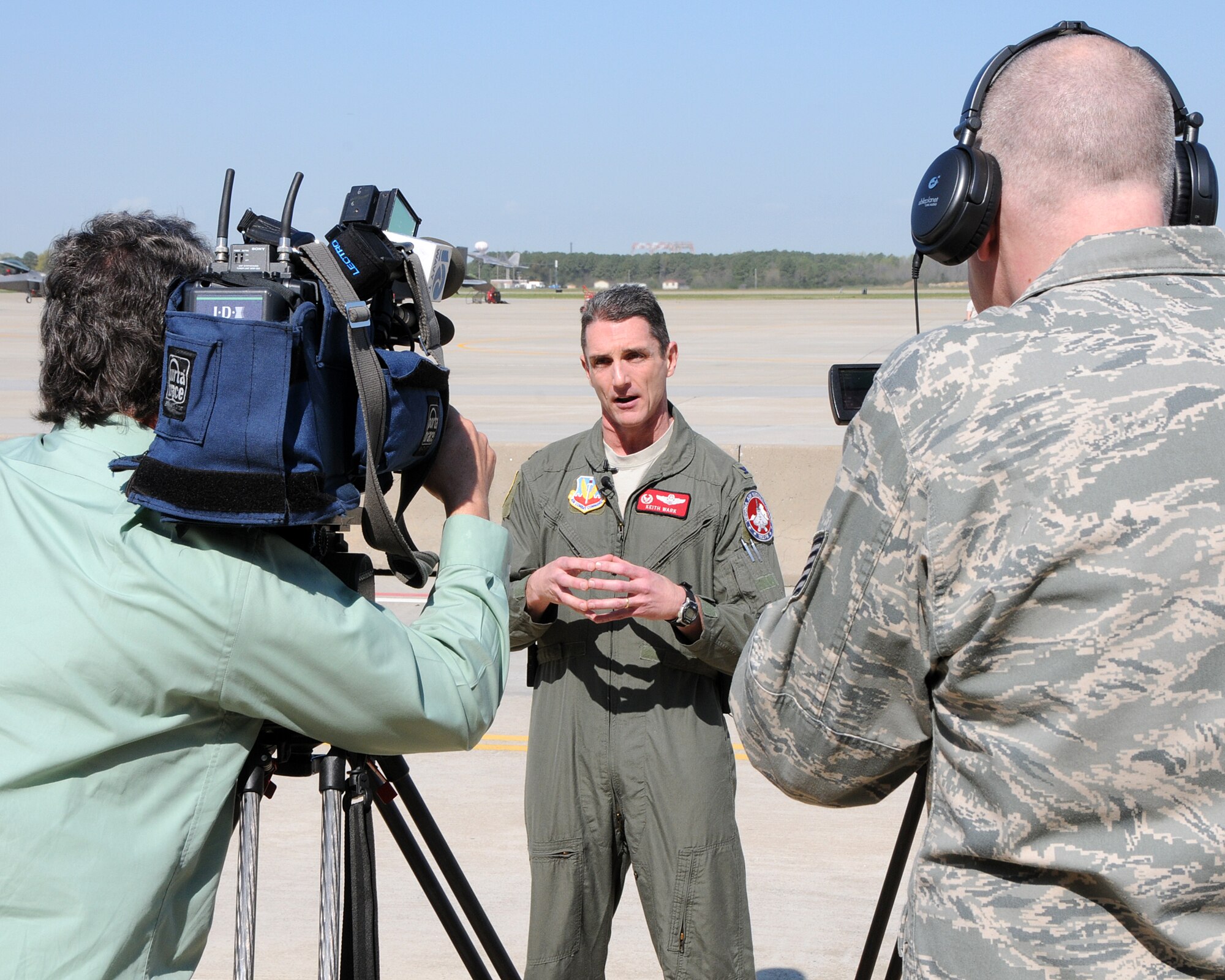 Col. Thomas K. Wark, 19nd Fighter Wing commander, talks to members of the media before the arrival of the wing’s new flagship F-22 Raptor at Langley Air Force Base, Va., March 22, 2012.  The aircraft bears tail number 09-0192, which shares the namesake of the Virginia Air National Guard unit. (National Guard Photo by Master Sgt. Carlos J. Claudio/Released)
