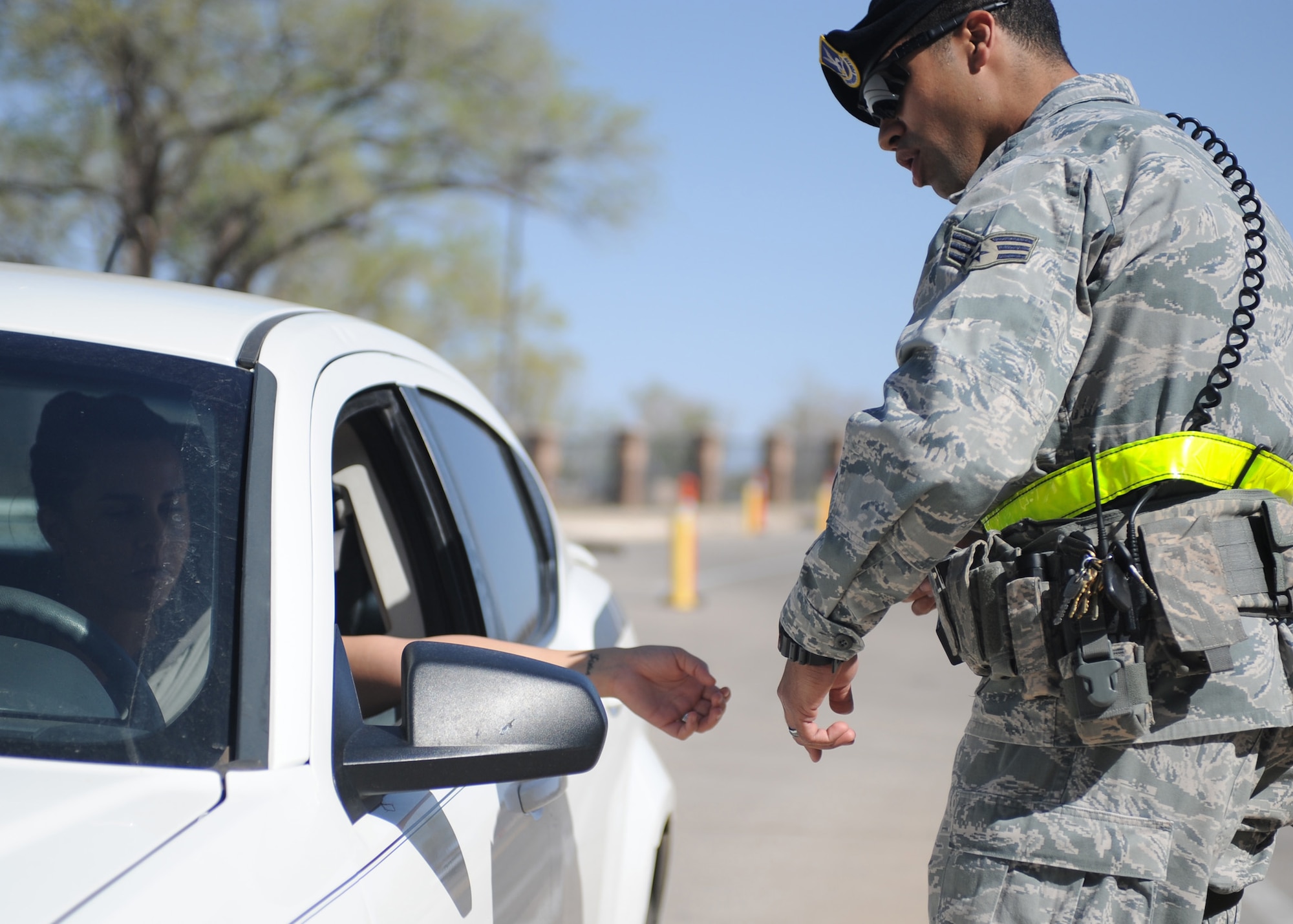 U.S. Air Force Senior Airman Victor Rodriguez, 27th Special Operations Security Forces Squadron patrolman, randomly selects a vehicle for inspection at the main gate at Cannon Air Force Base, N.M., March 27, 2012. Random vehicle inspections are just one way security forces troops ensure the safety of all Air Commandos, families and visitors. (U.S. Air Force photo by Airman 1st Class Eboni Reece)