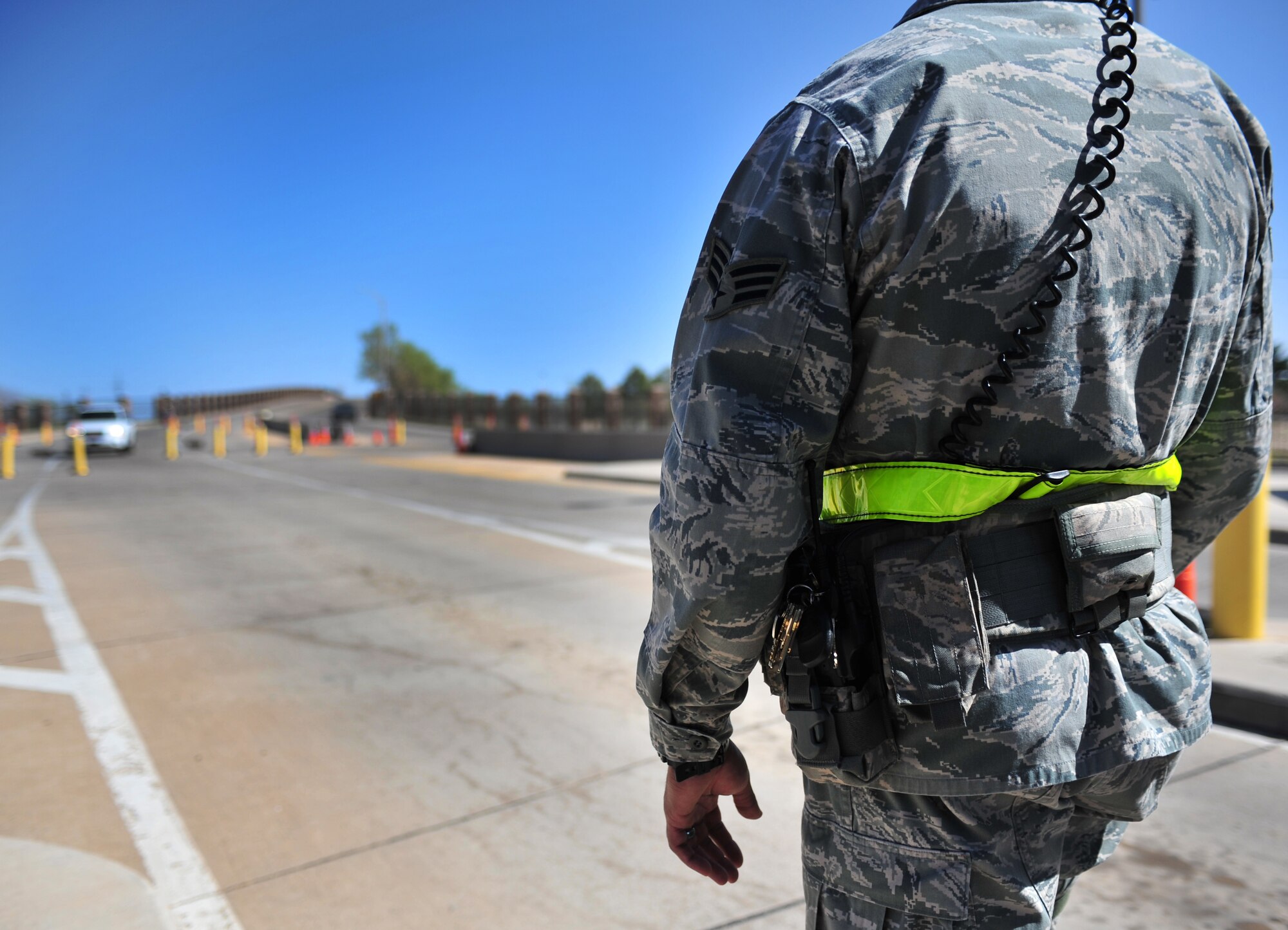 U.S. Air Force Senior Airman Victor Rodriguez, 27th Special Operations Security Forces Squadron patrolman, monitors base entry at the main gate at Cannon Air Force Base, N.M., March 27, 2012. Security forces troops ensure the safety of all Air Commandos, families and visitors. (U.S. Air Force photo by Airman 1st Class Alexxis Pons Abascal)