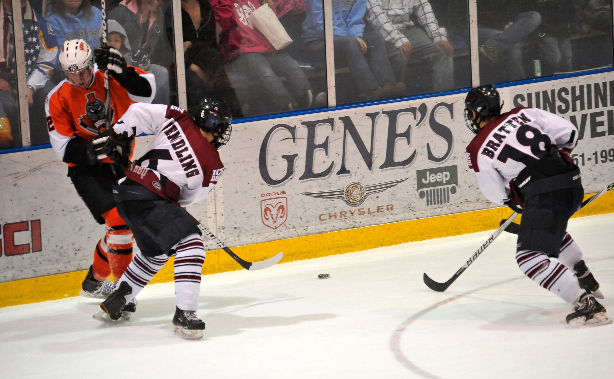 Fairbanks Ice Dogs forward Logan Wendling crashes a Dawson Creek Rage member into the boards during a Military Appreciation game at Big Dipper Arena, March 30, 2012, Fairbanks, Alaska.  The Ice Dogs edged the Rage 6-5. (U.S. Air Force photo/Staff Sgt. Miguel Lara III)