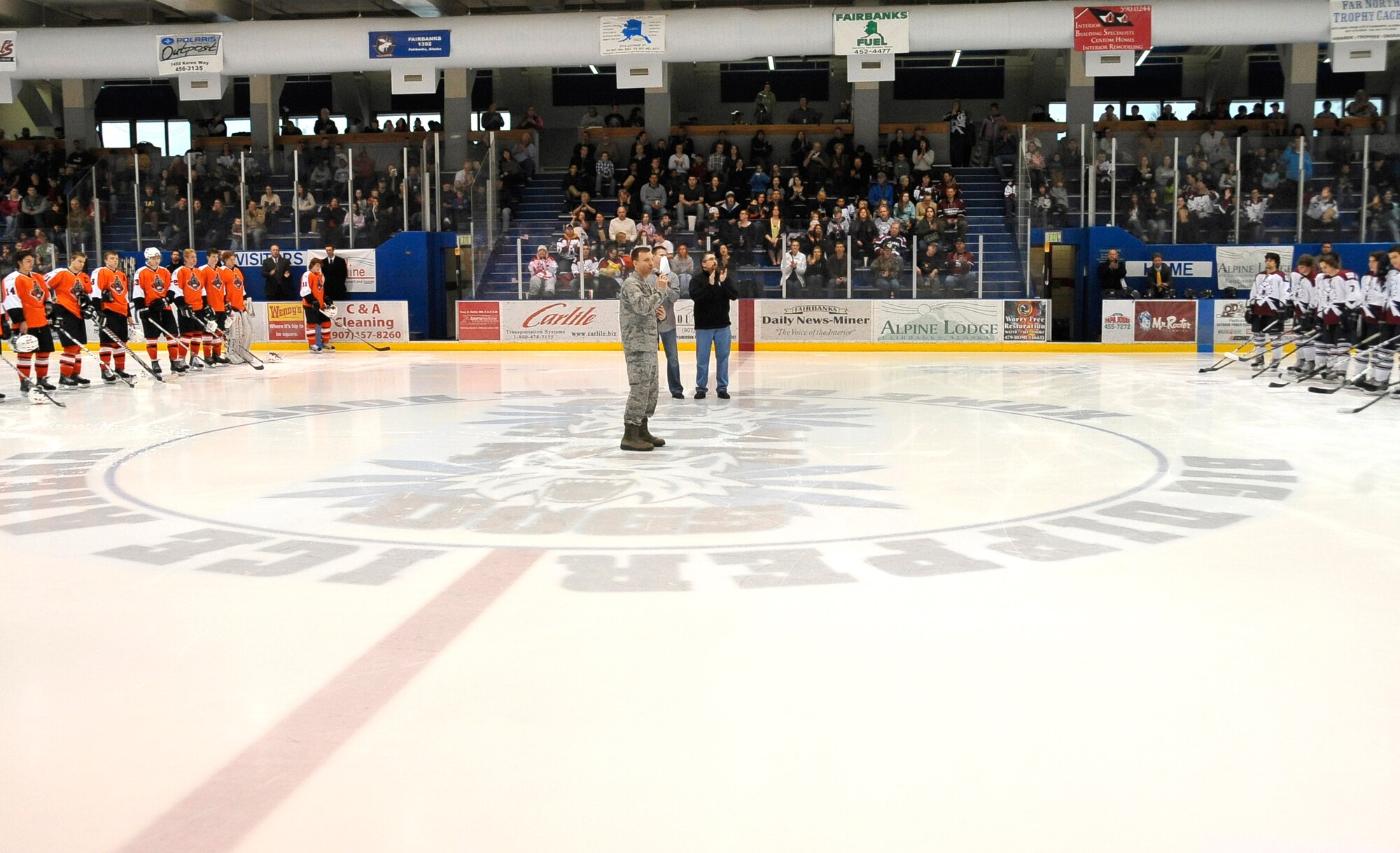 U.S. Air Force Col. Lynn Scheel, 354th Fighter Wing vice commander, speaks before a crowd of 2,242 to kick-off Military Appreciation Weekend at the Big Dipper Arena, March 30, 2012, Fairbanks, Alaska.  (U.S. Air Force photo/Staff Sgt. Miguel Lara III)