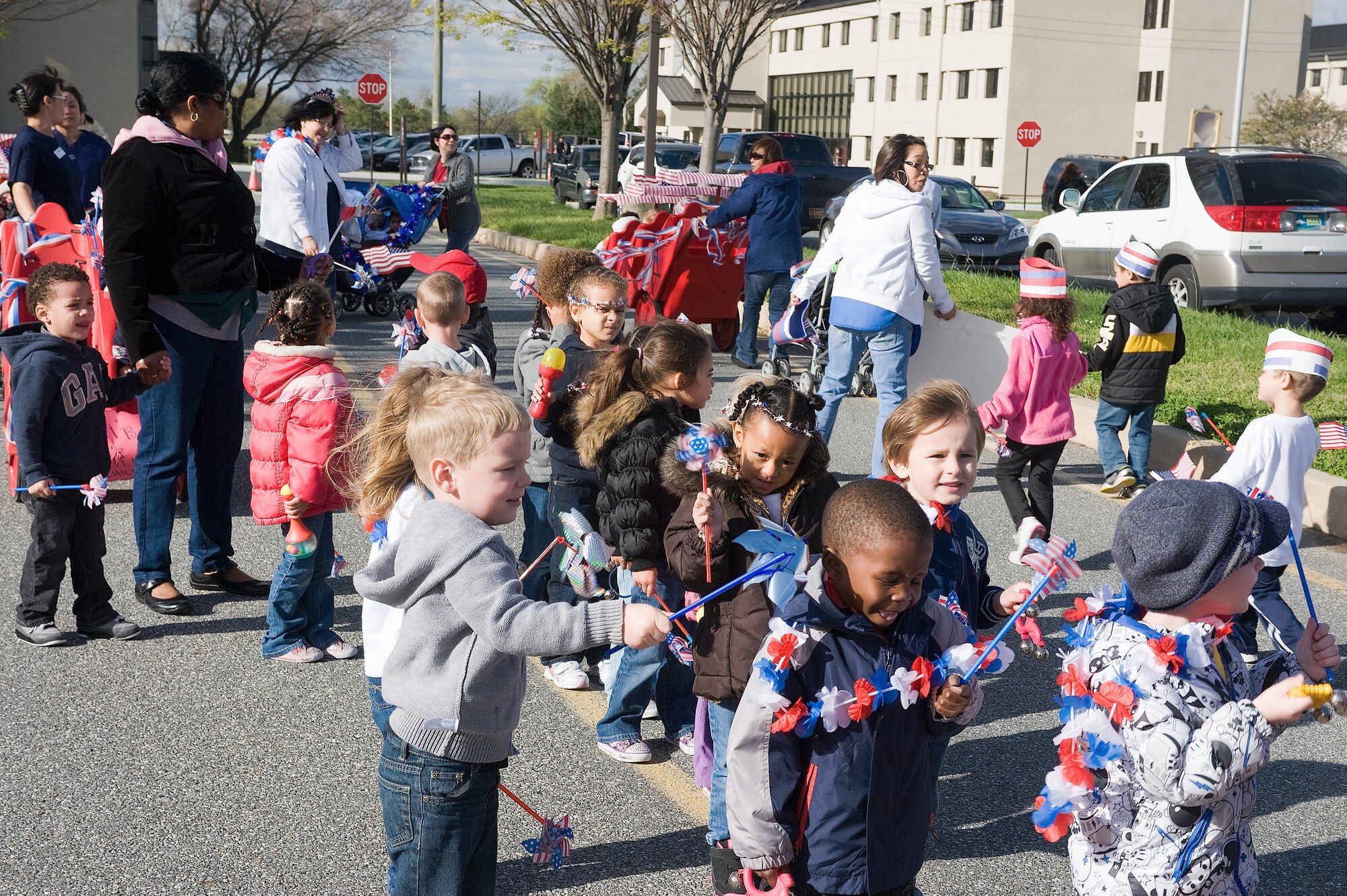 Children from the Dover Air Force Base, Del., Child Development Center march in the Month of the Military Child kick-off parade April 2, 2012, at Dover AFB. The Month of the Military Child honors the challenges military dependants endure, including deployments and permanent changes of station. (U.S. Air Force photo by Steve Kotecki)