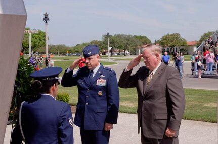 Col. Richard M. Murphy, 12th Flying Training Wing commander, and retired Lt. Col. Charles Brame lay a wreath at the foot of the Missing Man Monument on Joint Base San Antonio-Randolph during the Freedom Flyer reunion March 30.  (U.S. Air Force Photo by Don Lindsey)