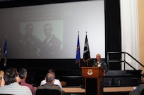 Retired Col. "Smitty" Harris, Freedom Flyer 105 addresses the audience during the 15th annual Freedom Flyer Symposium March 30 in the Joint Base San Antonio- Randolph theater. ( U.S. Air Force Photo by Don Lindsey)