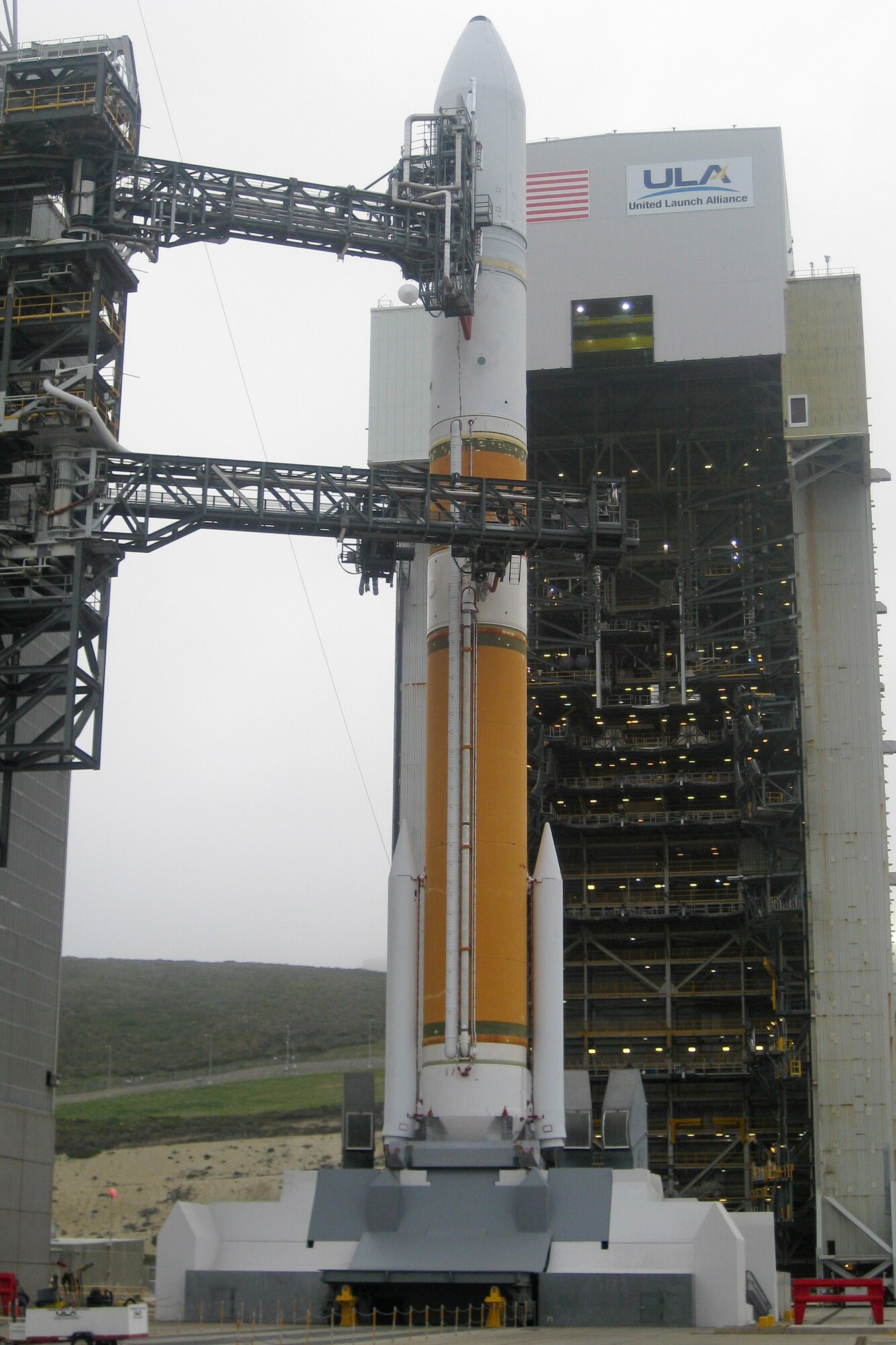 VANDENBERG AIR FORCE BASE, Calif. -- The mobile service tower rolls back from the United Launch Alliance Delta IV Medium+ (5,2) rocket on Space Launch Complex 6 here Tuesday, April 3, 2012. This is the Department of Defense?s first-ever launch of a Delta IV configured with a 5-meter payload fairing and two solid rocket motors. (U.S. Air Force photo/Kathi Peoples)
