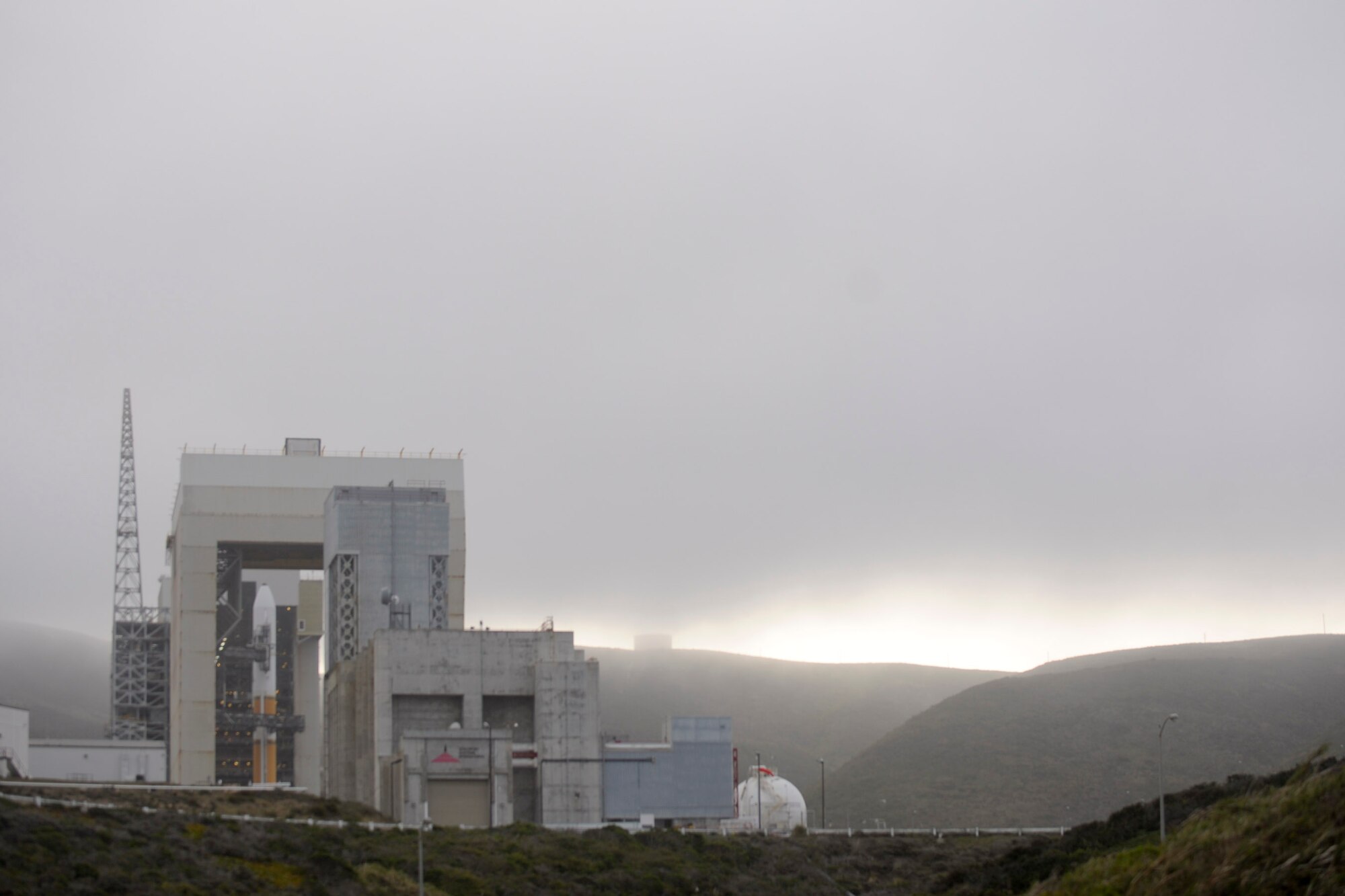 VANDENBERG AIR FORCE BASE, Calif. -- The mobile service tower rolls back from the United Launch Alliance Delta IV Medium+ (5,2) rocket on Space Launch Complex 6 here Tuesday, April 3, 2012. This is the Department of Defense?s first-ever launch of a Delta IV configured with a 5-meter payload fairing and two solid rocket motors. (U.S. Air Force photo/Staff Sgt. Andrew Satran)