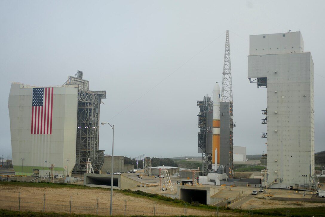 VANDENBERG AIR FORCE BASE, Calif. -- The mobile service tower rolls back from the United Launch Alliance Delta IV Medium+ (5,2) rocket on Space Launch Complex 6 here Tuesday, April 3, 2012. This is the Department of Defense?s first-ever launch of a Delta IV configured with a 5-meter payload fairing and two solid rocket motors. (U.S. Air Force photo/Staff Sgt. Andrew Satran)