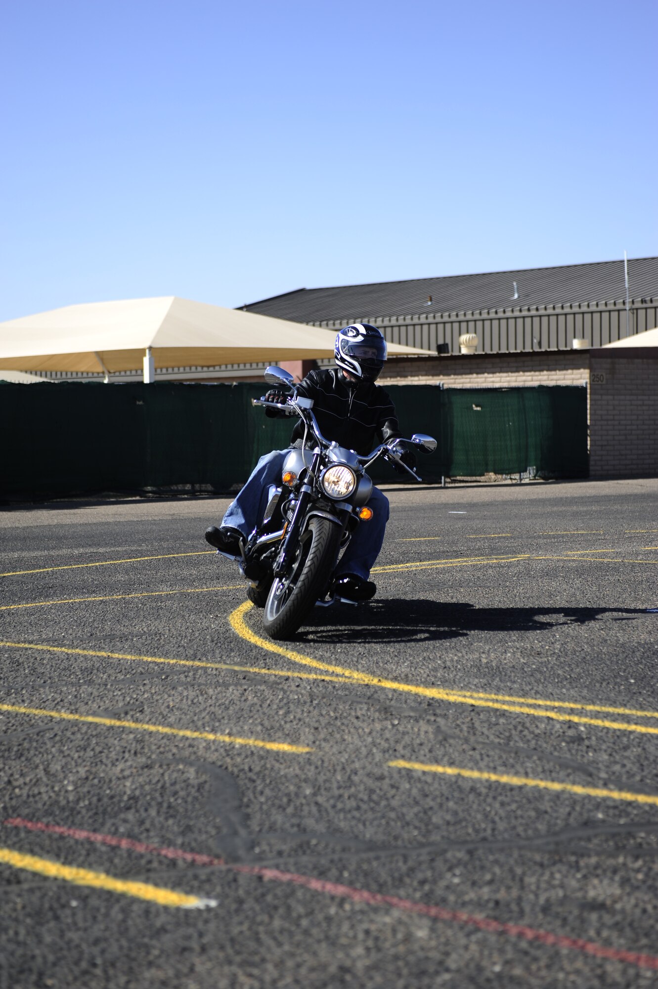 U.S. Navy Petty Officer 1st Class Doug Kreie, Navy Recruiting District Phoenix, practices cornering during the advanced riders course held at Luke Air Force Base, Ariz., March 09, 2012. Thanks to courses such as this, Luke AFB only experienced four motorcycle mishaps in fiscal year 2011, a decrease from the past three years by 35%. (U.S. Air Force photo by Staff Sgt. Jason Colbert)