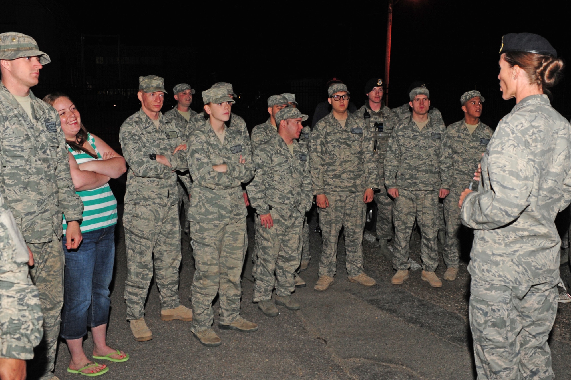 U.S. Air Force 1st Lt. Kimberly Guest talks with returning 4th Security Forces Squadron Airmen on Seymour Johnson Air Force Base, N.C., April 2, 2012. The group is returning home from a six-month deployment to Kandahar Airfield, Afghanistan, in support of Operation Enduring Freedom. Guest is the 4th SFS operations officer. (U.S. Air Force photo/Airman 1st Class Mariah Tolbert/Released)