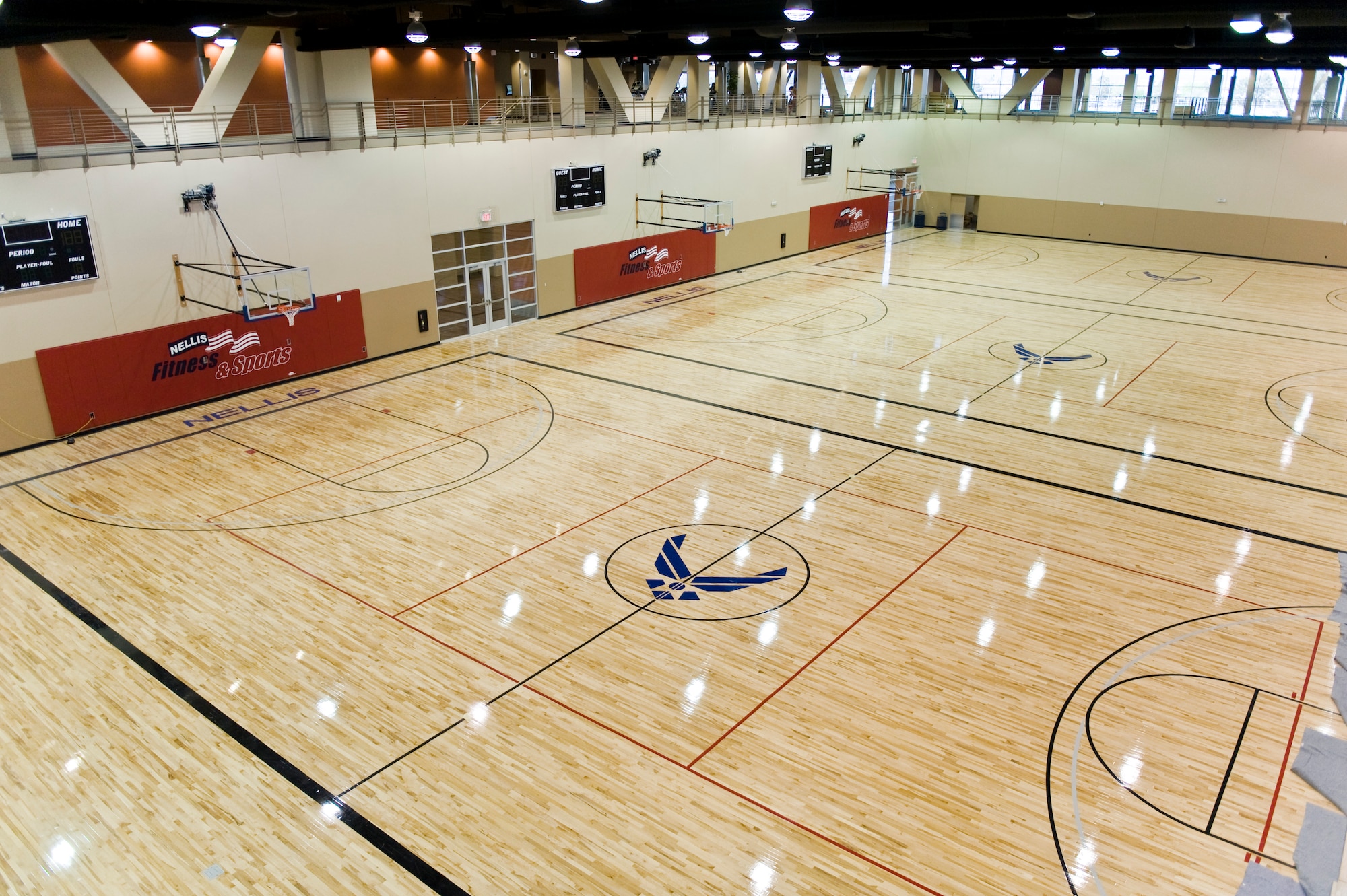 The Warrior Fitness Center's three basketball courts March 29, 2012, at Nellis Air Force Base, Nev. The state-of-the-art fitness center will be host to a variety of intramural sports events. (U.S. Air Force photo by Lawrence Crespo)
