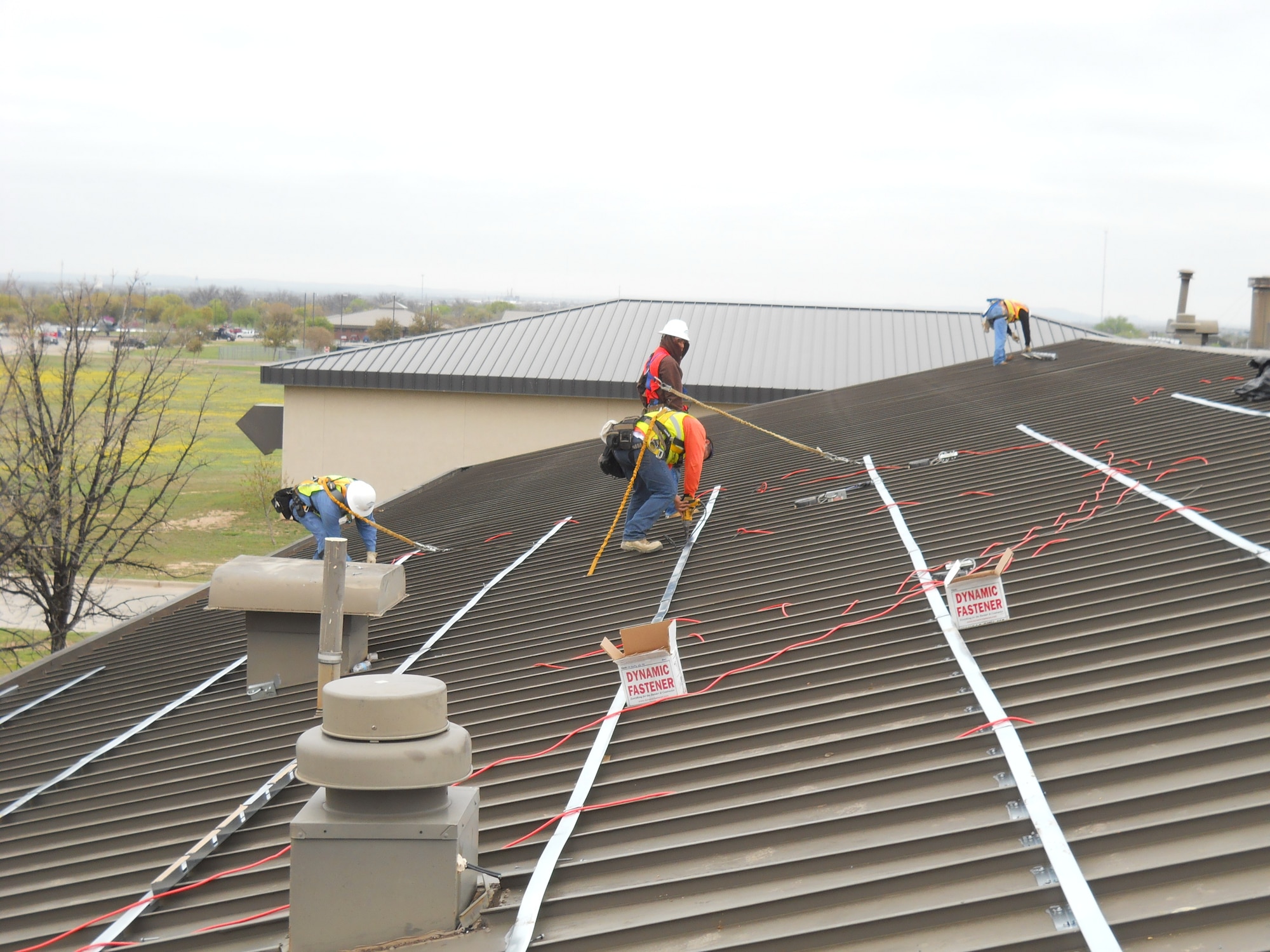GOODFELLOW AIR FORCE BASE, Texas - Contractors install a sub-purling system which was installed over the existing roof structural members to meet design, wind and gravity requirements. (U.S. Air Force photo/Brian Mousavi)

