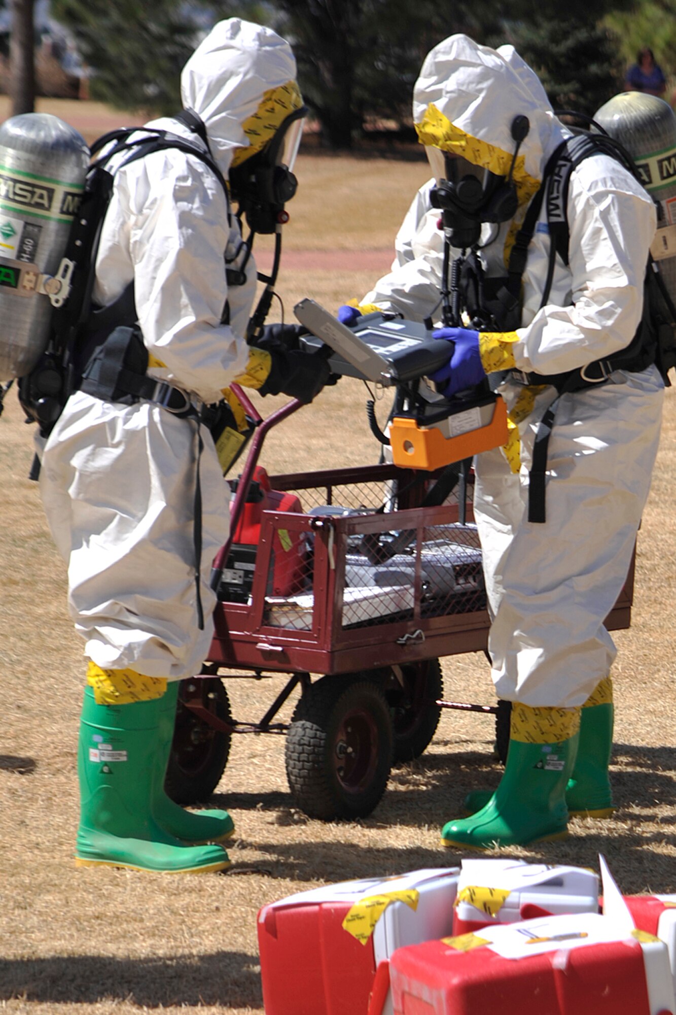 PETERSON AIR FORCE BASE, Colo. - The 21st Bioenvironmental Engineering and Environmental Flights held an emergency management training exercise March 27 at Eagle Park. The training, designed to allow the flights to work together more efficiently, involved an aircraft emergency landing scenario. During the exercise, the two flights had to work through their checklists together to identify radioactive cargo on the aircraft, and determine if it was hazardous to people. (U.S. Air Force photo/Dennis Howk)