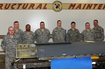 MINOT AIR FORCE BASE, N.D. -- From left to right: Tech. Sgt. Darren Bivins, Master Sgt. Sean Holm, Staff Sgt. Eric Alexander, Tech. Sgt. Jeffrey Kinlaw, Airman 1st Class Kenneth Abbott, Senior Airman Jason Bressler, Airman 1st Class Joshua Gatley, and Chief Master Sgt. Kevin Jurgella

Members of the 5th Maintenance Squadron aircraft structural maintenance shop fabricate, restore, and refurbish B-52H Stratofortress components and parts to provide flight line and backshop support. The 55 member aircraft structural maintenance team maintains corrosion control and painting operations for aircraft and aerospace ground equipment to ensure proficiency and certification of materials critical to mission effectiveness by allowing reliable nuclear and conventional operations. (Photo Submission/Tech. Sgt. Mark Frederici)
