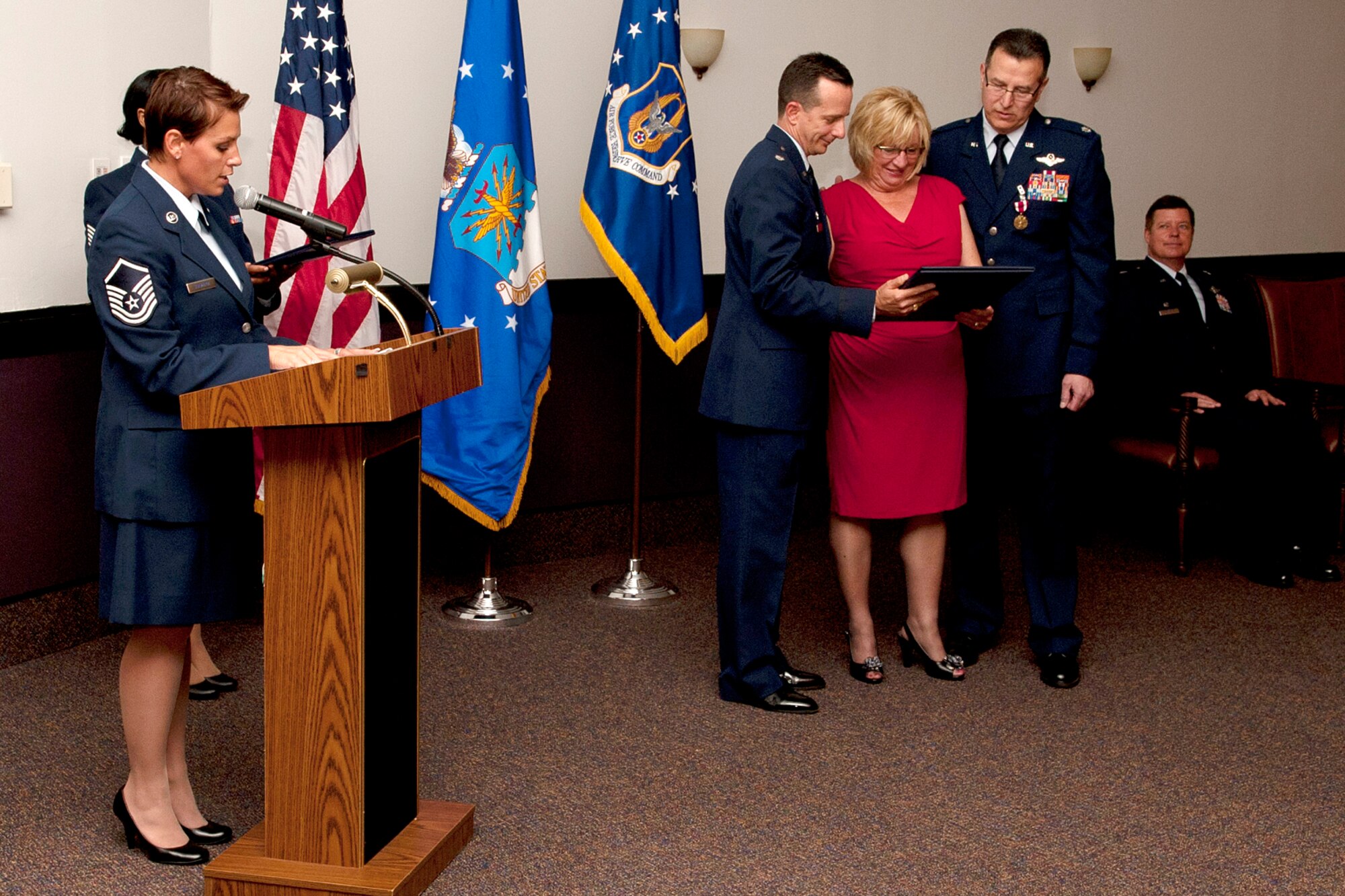 Sandy Rodriguez is presented the spouse appreciation certificate during the retirement ceremony for her husband, U.S. Air Force Lt. Col. Rafael Rodriguez, at Barksdale Air Force Base, La., April 1, 2012. Sandy and her husband, a radar navigator assigned to the 343rd Bomb Squadron, have been married for 27 years. (U.S. Air Force photo by Master Sgt. Greg Steele/Released)