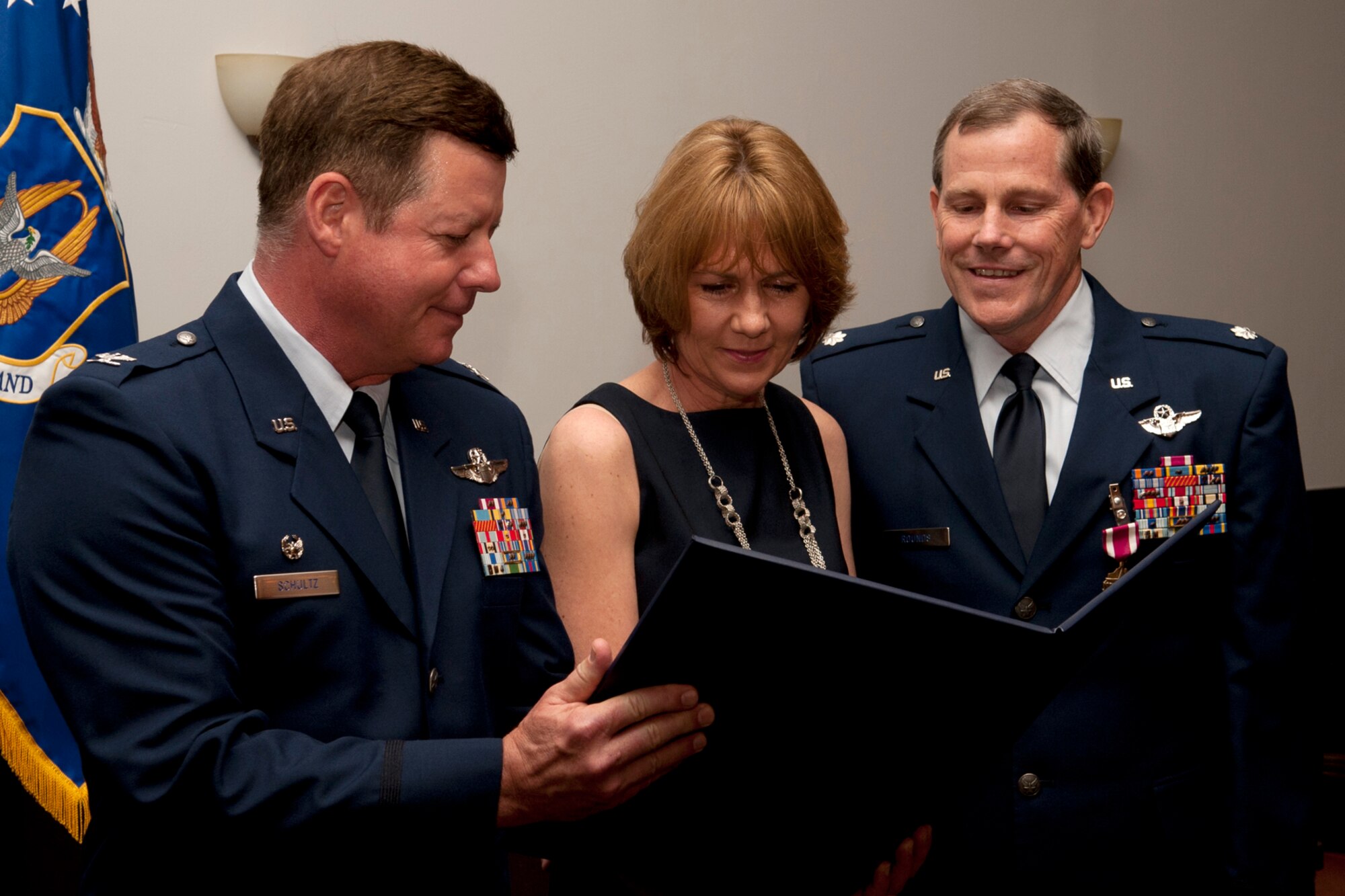 Linda Rounds, the wife of U.S. Air Force Lt. Col. Chris Rounds, is presented the spouse appreciation certificate during a retirement ceremony at Barksdale Air Force Base, La., April 1, 2012. The couple have been married for 25 years and Rounds is retiring from the Air Force Reserve. (U.S. Air Force photo by Master Sgt. Greg Steele/Released)
