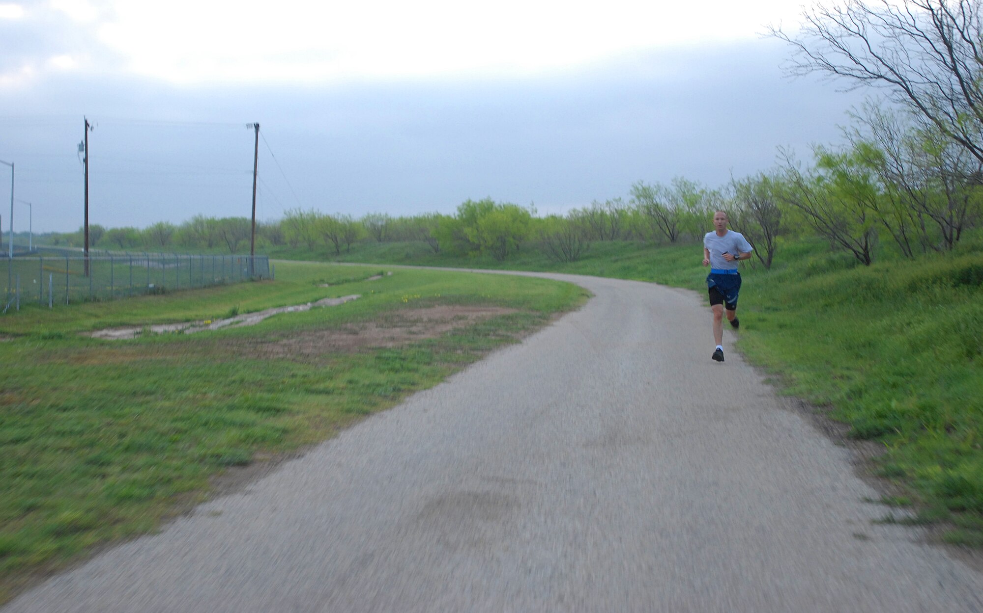GOODFELLOW AIR FORCE BASE, Texas-- Master Sgt. Douglas Hackelton, 315th Training Squadron, pushes through the last quarter mile of the 2012 Survivor Run, March 30. The three mile run also included three challenges that tested the competitors mentally and physically. (U.S. Air Force photo/ Airman 1st Class Michael Smith)