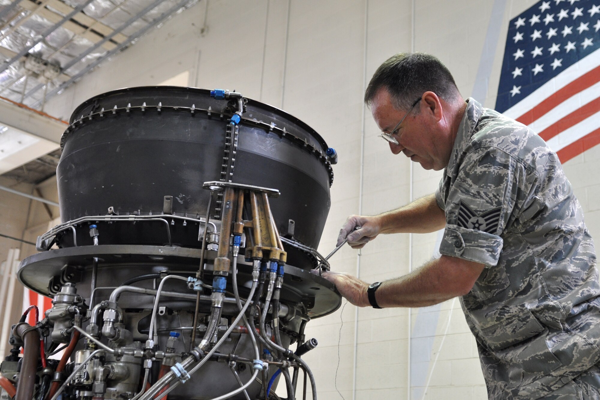Tech. Sgt. Jack Mills, an A-10 jet mechanic assigned to the 917th Maintenance Squadron, works on a TF-34 jet engine during the Unit Training Assembly weekend at Barksdale Air Force Base, La., March 31, 2012. Approximately 2,100 Reserve Airmen call Barksdale home at least one weekend a month in order to maintain their skills in hundreds of job fields, just in case they are called into action to support their local community, state or the United States of America. (U.S. Air Force photo by Master Sgt. Jeff Walston/Released) 