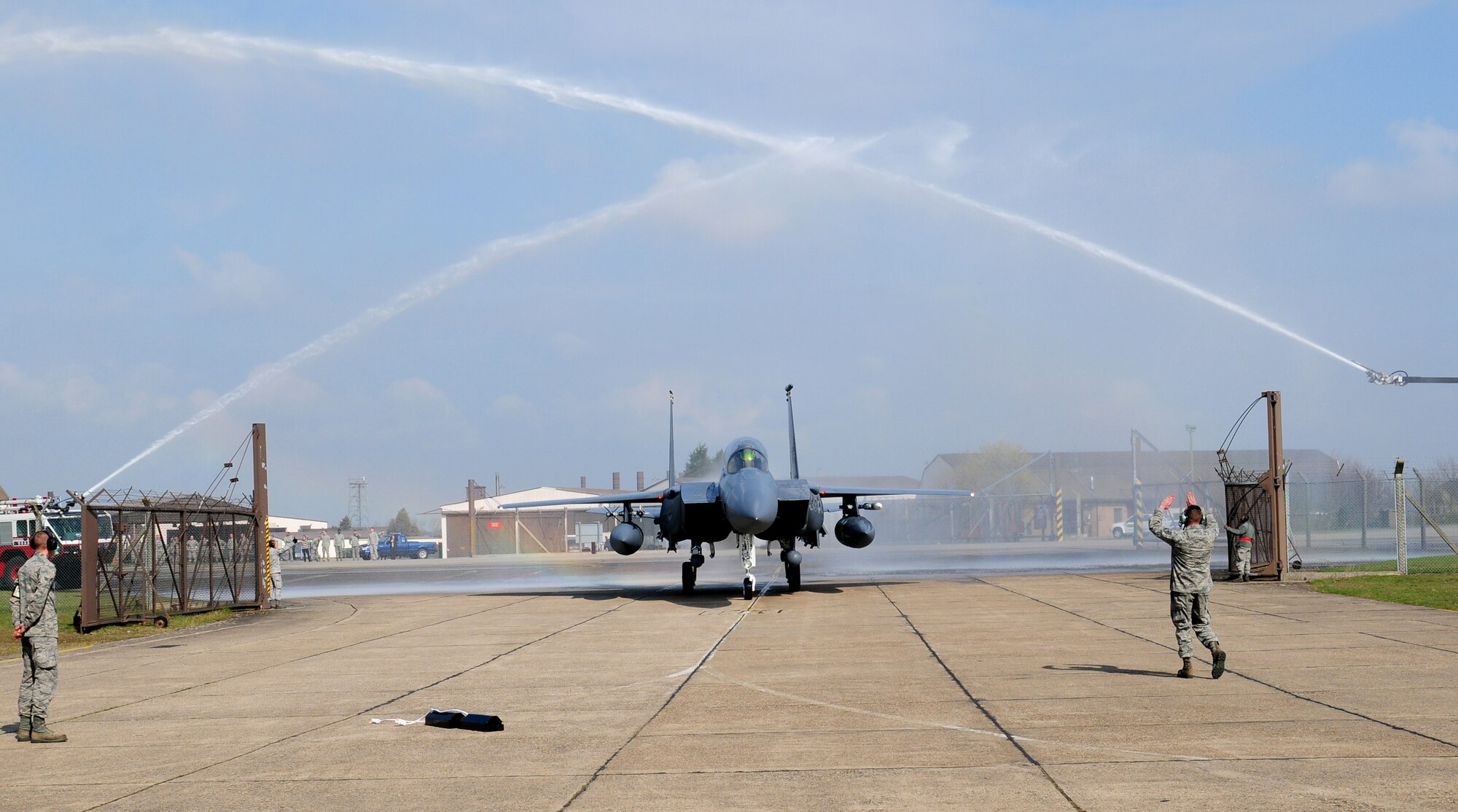 ROYAL AIR FORCE LAKENHEATH, England – Col. John Quintas, 48th Fighter Wing commander, taxis in an F-15E Strike Eagle through a water arch during his “fini” flight April 2, 2012. Quintas was greeted by friends and family to celebrate his last flight as the Liberty Wing commander. (U.S. Air Force photo by Airman 1st Class Cory D. Payne)