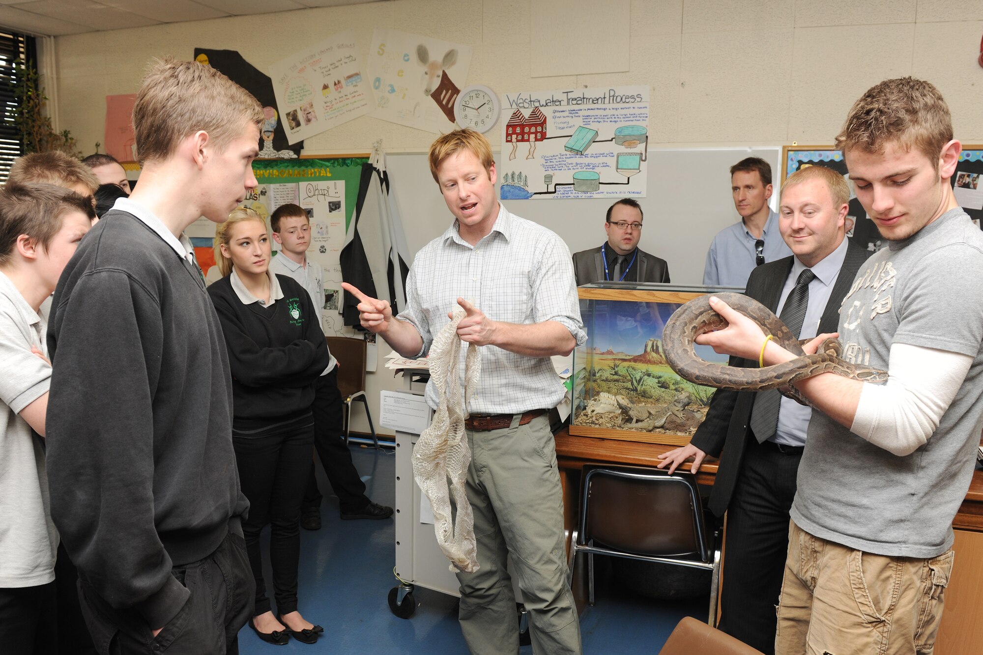 RAF ALCONBURY, United Kingdom - Students from The Manor get a taste of an American High School classroom experience during a tour of the American base conducted by Defenders from the 423rd Security Forces Squadron March 27. Airmen from the 423rd SFS participate in a weekly-mentorship program with the students. (U.S. Air Force photo by Senior Airman Joel Mease)