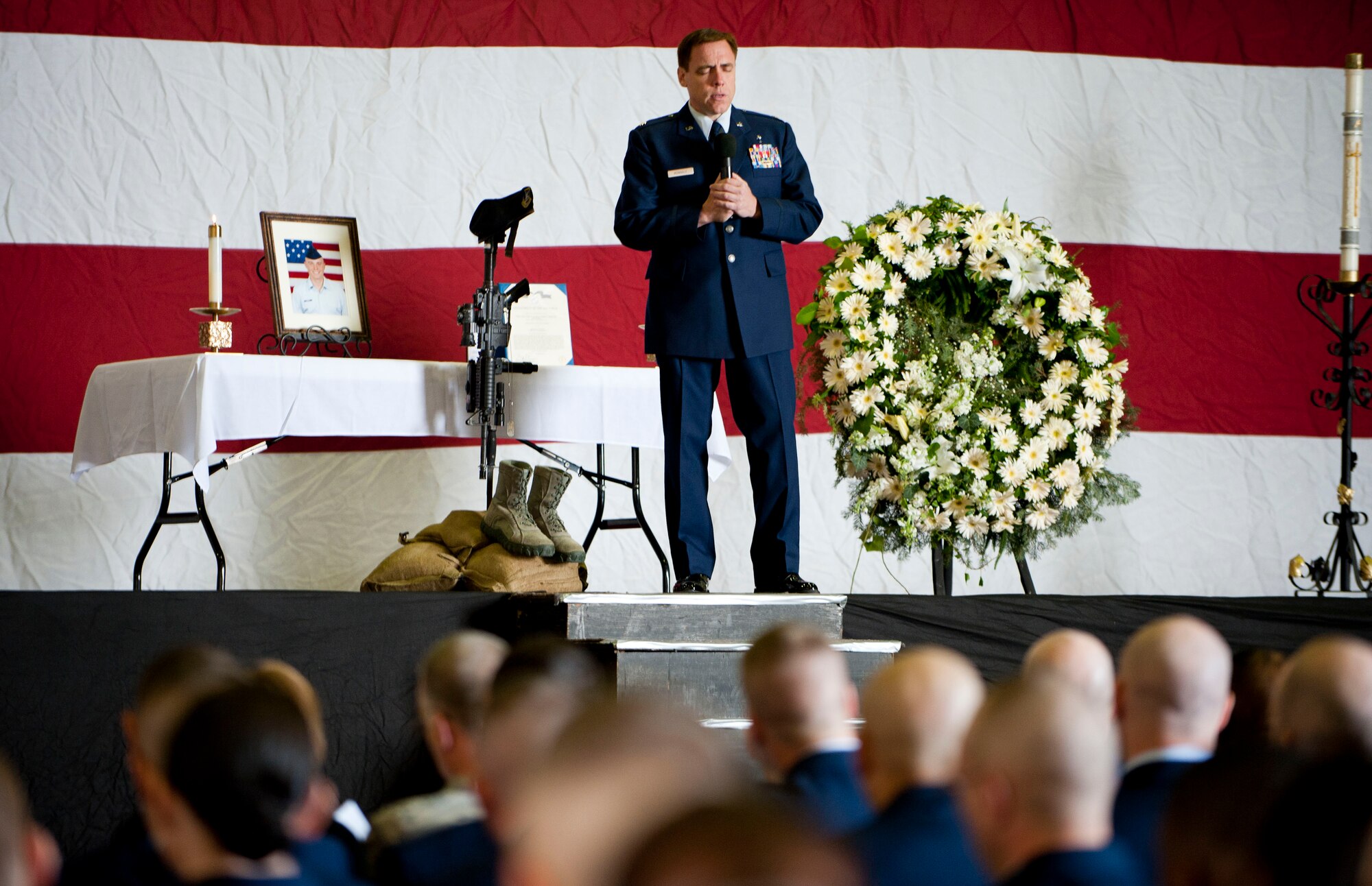Chaplain (Maj.) Robert Monagle, 39th Air Base Wing, delivers a brief sermon during a memorial service for Airman 1st Class Joel Barrow March 30, 2012, at Incirlik Air Base, Turkey. The ceremony honored the life of Barrow, a member of the 39th Security Forces Squadron Bravo Flight who died March 27. (U.S. Air Force photo by Senior Airman Clayton Lenhardt/Released)