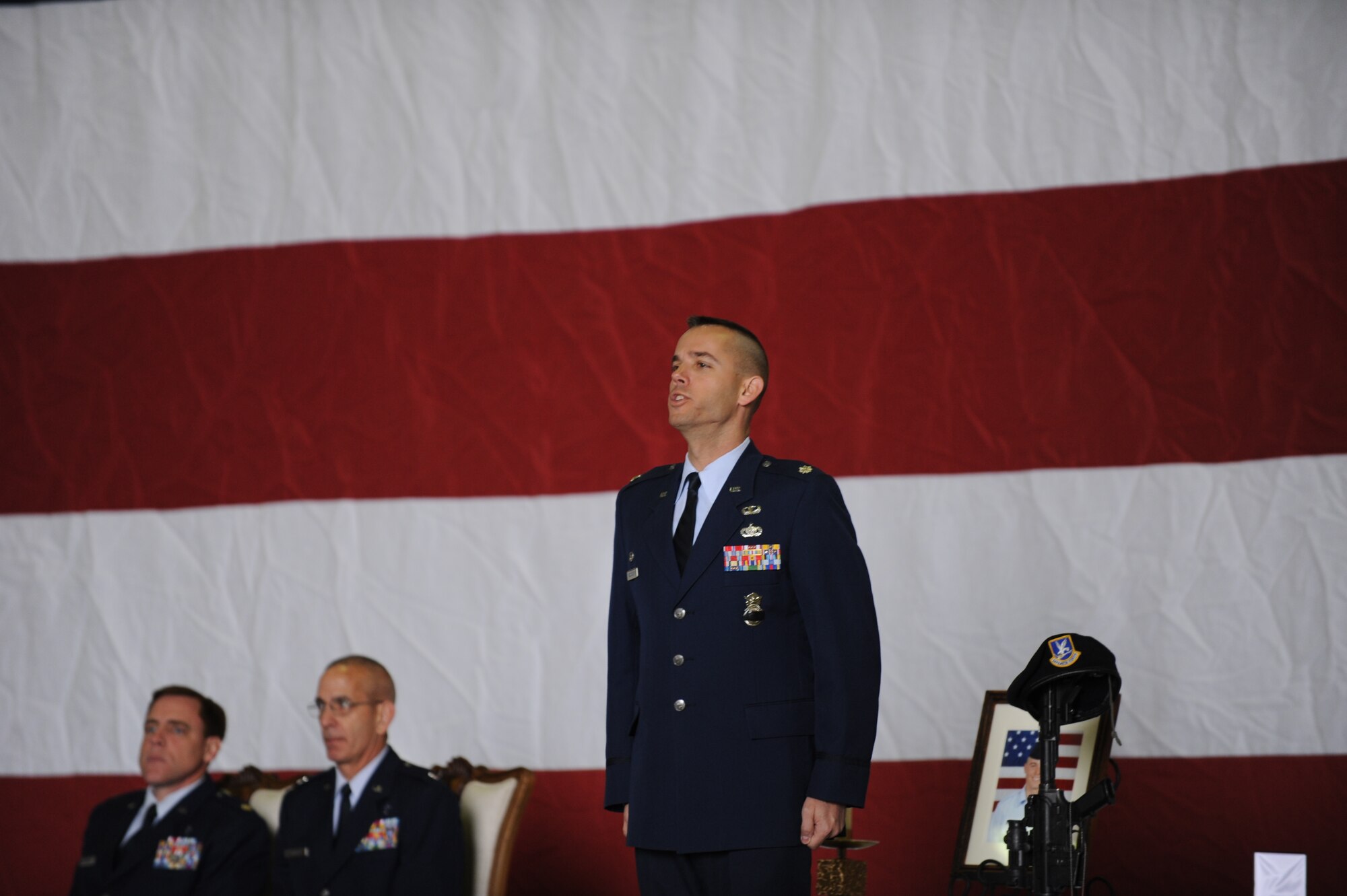 Lt. Col. Brint Woodruff, 39th Security Forces Squadron commander, stands at attention during roll call at the memorial for Airman 1st Class Joel Barrow March 30, 2012, at Incirlik Air Base, Turkey. The ceremony honored the life of Barrow, a 39th Security Forces Squadron security response team member who died March 27. (U.S. Air Force photo by Senior Airman Jarvie Z. Wallace/Released) 
