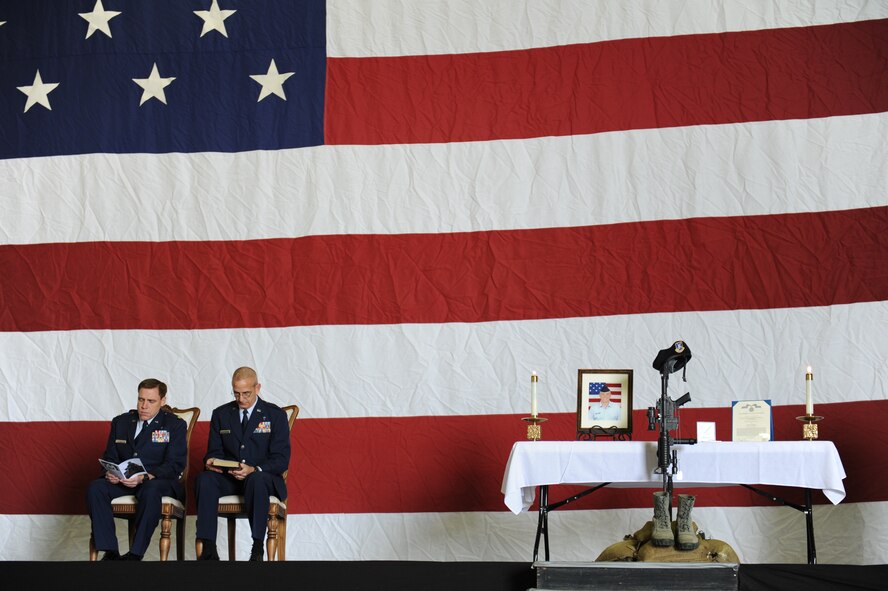 Chaplain (Maj.) Robert Monagle, left, and Chaplain (Lt. Col.) Scott Rummage, both of the 39th Air Base Wing, listen as hymns are sung during the memorial for Airman 1st Class Joel Barrow March 30, 2012, at Incirlik Air Base, Turkey. The ceremony honored the life of Barrow, a 39th Security Forces Squadron security response team member who died March 27. (U.S. Air Force photo by Senior Airman Jarvie Z. Wallace/Released) 