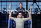 U.S. Air Force Senior Airman Whitney Massey, 99th Force Support Squadron services journeyman, spots Airman 1st Class Benjamin Hurst on the free weights at the Warrior Fitness Center April 2, 2012, at Nellis Air Force Base, Nev. The state-of-the-art facility's strength training equipment offers Magnum, Nautilus Hammer Strength, Free Motion and Hampton Rubber Bumper Plates training.  (U.S. Air Force photo by Lawrence Crespo)
