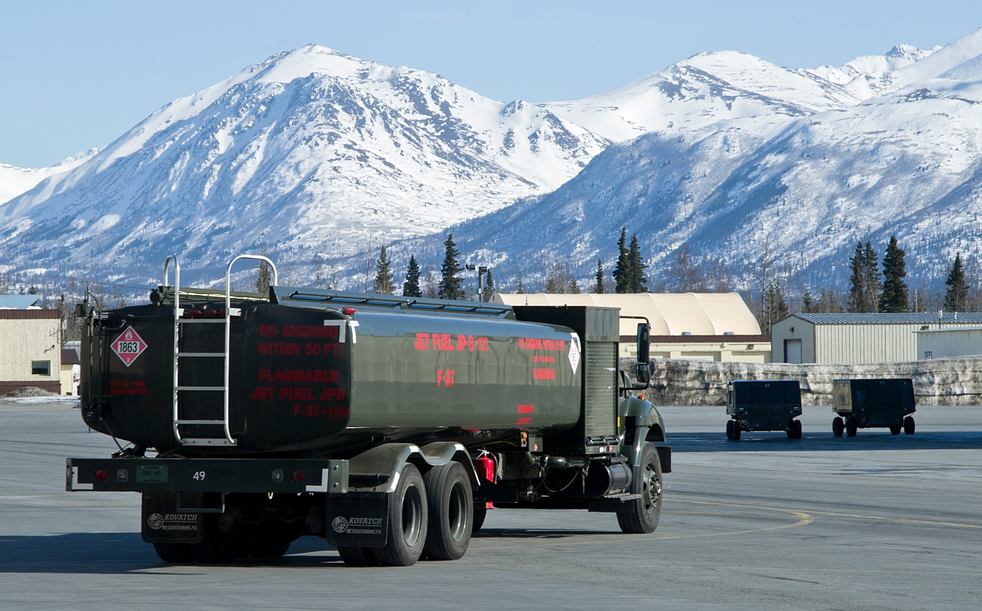 A R-11 fuel truck drives away after refueling an F-22 Raptor fighter on Joint Base Elmendorf-Richardson April 3, 2012. The R-11 fuel trucks can hold up to 6,000 gallons of fuel. (U.S. Air Force photo/Staff Sgt. Zachary Wolf)
