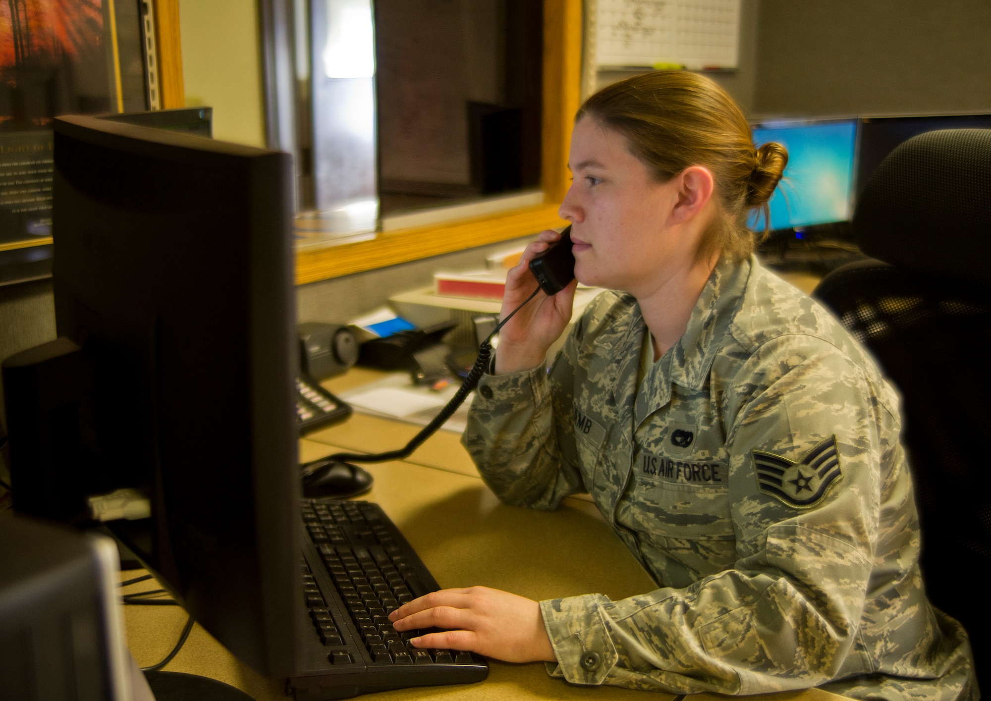 Air Force Staff Sgt. Jamie Lamb, 673d Logistics Readiness Squadron fuels service center controller, takes a request for fuel over the phone on Joint Base Elmendorf-Richardson March 30, 2012. The fuels service center is the central hub for everything fuel related. (U.S. Air Force photo/Staff Sgt. Zachary Wolf)