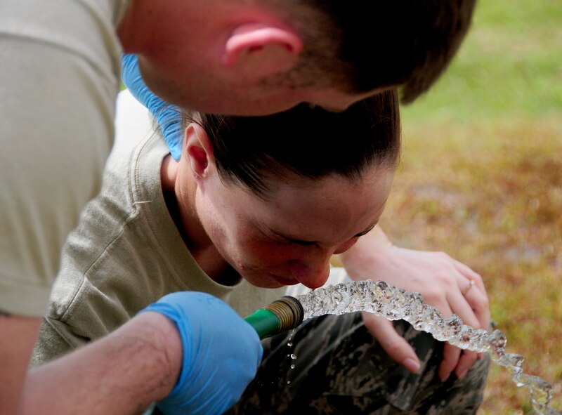 ANDERSEN AIR FORCE BASE, Guam –An Airman from the 36th Security Forces Squadron flushes her eyes after going through pepper spray training March 23. The 36 SFS requires Airmen to receive pepper spray familiarization training as one of there core skills. (U.S. Air Force photo by Senior Airman Jeffrey Schultze)