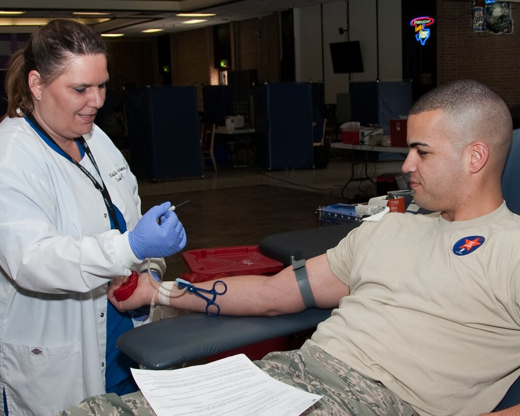 Carol Demmel, Supervisor for the Texas Blood Institute preps Staff Sgt.
David Montalro, a student with the 361st Training Squadron, to donate blood
April 3, 2012. The institute sets up about 27 stations and draws blood from
around 200-300 plus patients per day and will be accepting donations at the
Airman's Club from April 3-5 from 2-9 p.m. To donate or set up an
appointment call Staff Sgt. Angelia Ashley at (940)676-4900.  (U.S. Air
Force Photo/Frank Carter)