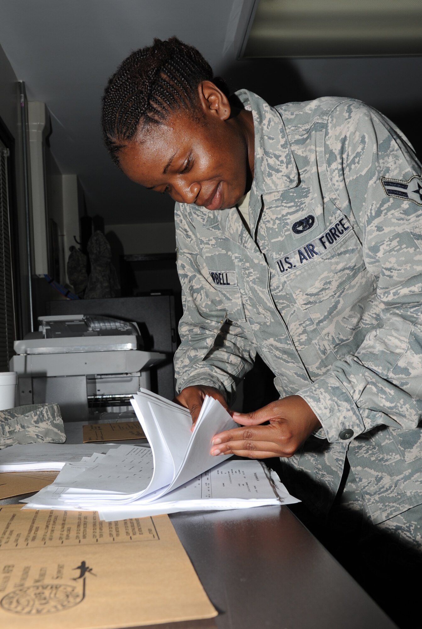 Airman First Class Alexis Campbell, 81st Logistics Readiness Squadron, is in-checking cargo during a deployment exercise March 29, 2012, inside the 81st Logistics Readiness Squadron warehouse at Keesler Air Force Base, Miss.  (U.S. Air Force photo by Kemberly Groue)