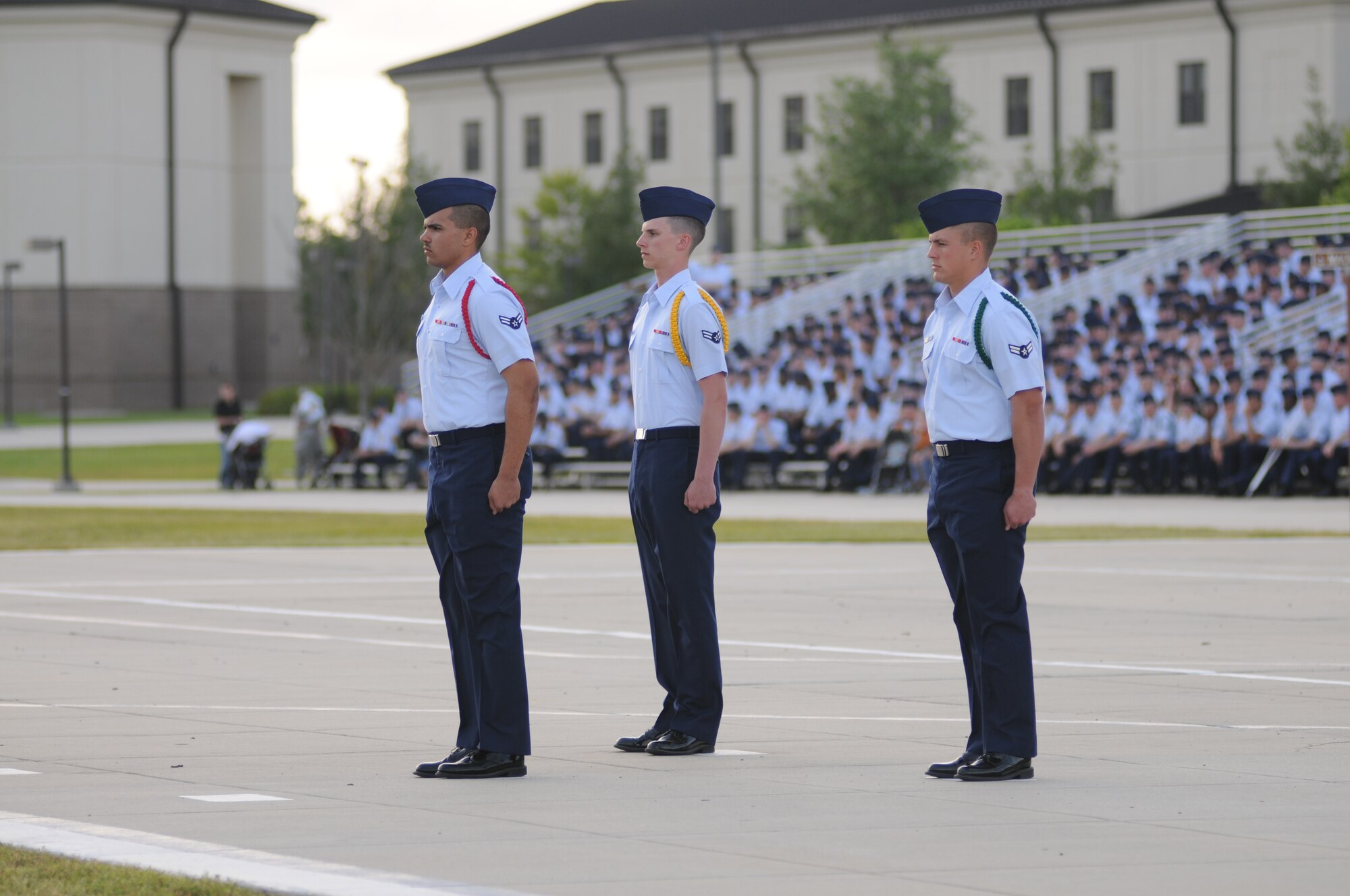 Airmen First Class Anthony Marino, parade commander of troops; Caleb Gunn, parade wing adjutant; and Tony Forsyth, parade staff officer, 334th Training Squadron, prepare to return a salute to the Officers Center during the student parade March 29, 2012, in the triangle area at Keesler Air Force Base, Miss.  (U.S. Air Force photo by Kemberly Groue)