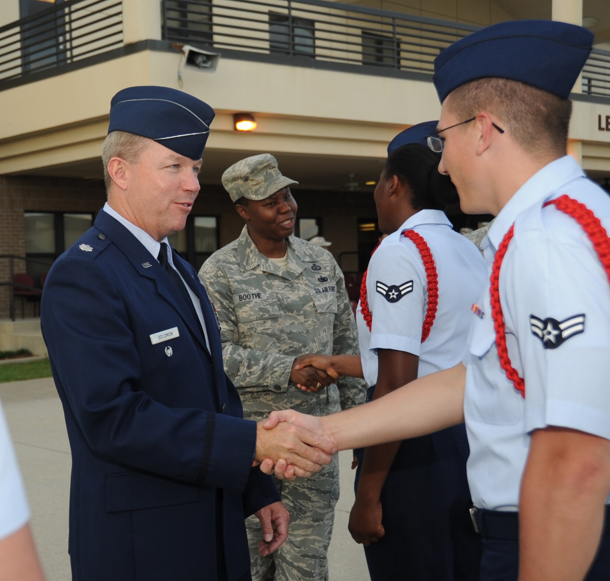 Lt. Col. Scott Solomon, 81st Training Group deputy commander, thanks Airman 1st Class Gregory Fox, 336th Training Squadron, for a job well done during the student parade March 29, 2012, in the triangle area at Keesler Air Force Base, Miss.  Solomon officiated over the parade which was his last before his permanent change of station.  (U.S. Air Force photo by Kemberly Groue)