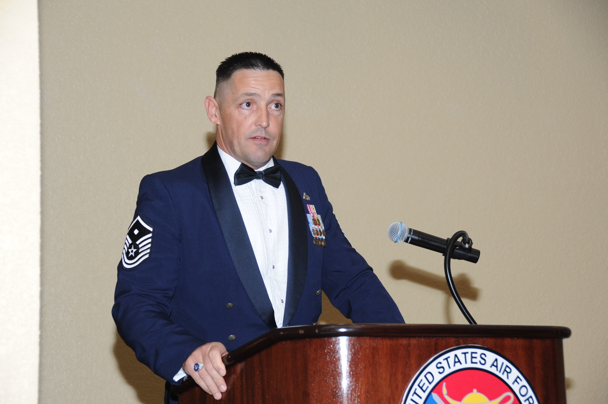 Master Sgt. Christopher Walton, 602nd Training Group (provisional) first sergeant, speaks to attendees at the Airman Leadership School graduation March 27, 2012, at the Bay Breeze Event Center, Keesler Air Force Base, Miss.  A first sergeant’s job is to take care of his or her people, they achieve this through participating in base events and interacting directly with their Airmen.  (U.S. Air Force photo by Kemberly Groue)
