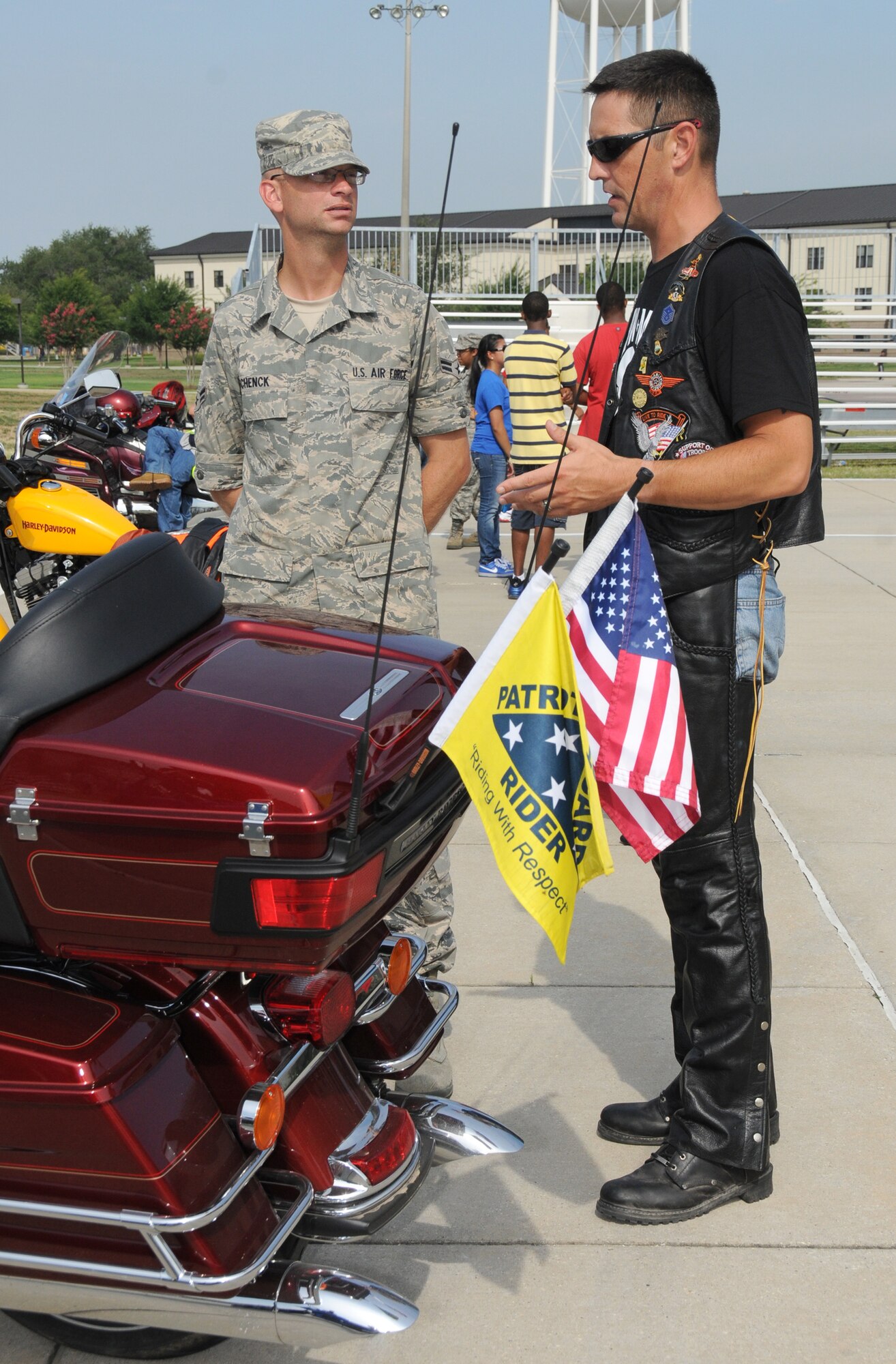 Master Sgt. Christopher Walton, 602nd Training Group (provisional) first sergeant, provides motorcycle safety information to Airman 1st Class Kevin Schenck, former 338th Training Squadron student, July 8, 2011, at the triangle training area, Keesler Air Force Base, Miss.  A first sergeant’s job is to take care of his or her people, they achieve this through participating in base events and interacting directly with their Airmen.  (U.S. Air Force photo by Kemberly Groue)