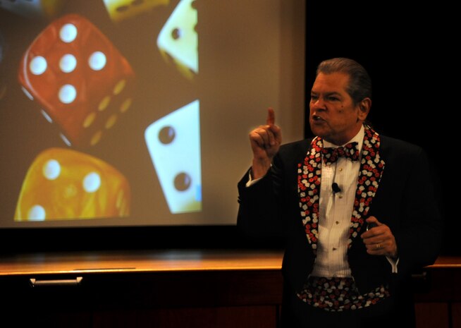 Guest speaker Ray "D.I.C.E. Man"  Semko addresses an audience at Joint Base Charleston April 2 as part of the Air Mobility Command Arms Control Treaty Workshop. Semko spoke about defensive information to counter everything, using a high-energy, high-impact briefing. His goal was to get listeners to understand they can make a difference in keeping their family and their work place secure.   (U.S. Air Force photo / Airman 1st Class Ashlee Galloway)